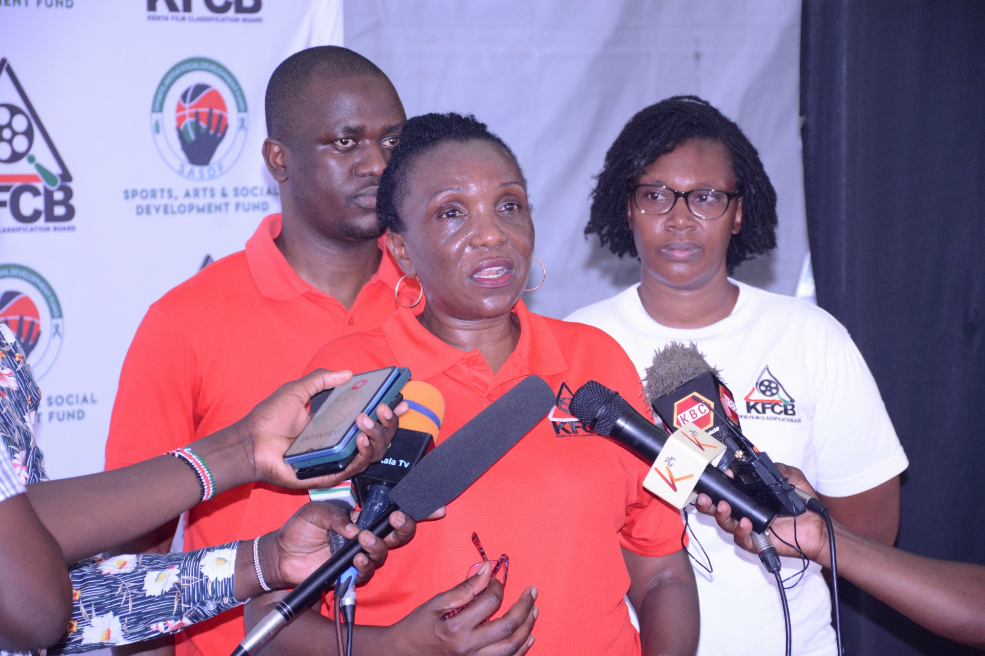 Ms Nelly Muluka,KFCB's Chief Manager for Corporate Services and Administration  flanked by Mr. Marcos Masiga, the Acting Manager for Licensing and Ms  Josephine Gitiri , KFCB's  Western Regional Head in a press briefing  during a press briefing during a stakeholder  engagement forum for creatives in Kisumu