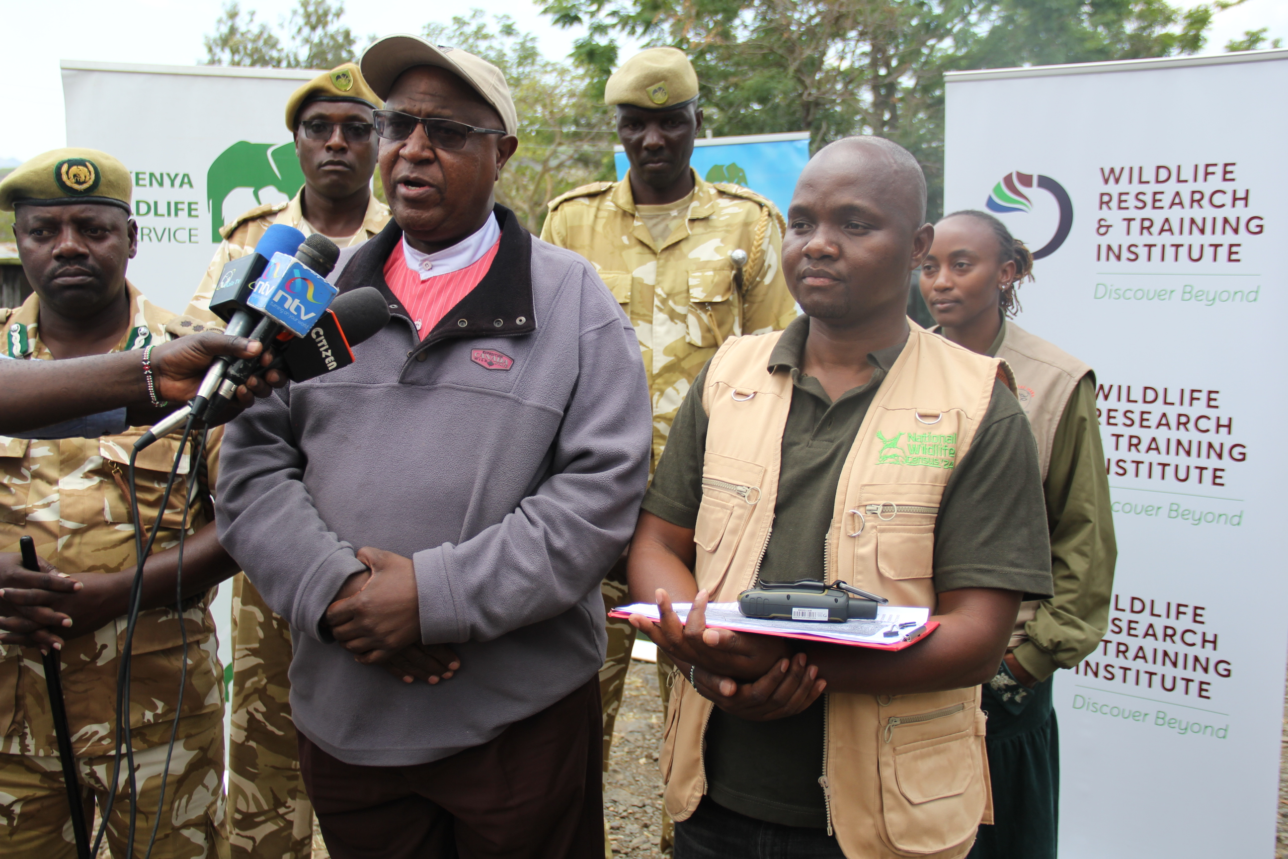 Natural Resource Management Scientist Joseph Gathua (center) briefing the press. On the right is WRTI Research Scientist Vasco Nyaga while on the left is KWS Western Conservancy Senior Assistant Director Mungumi Chongwa