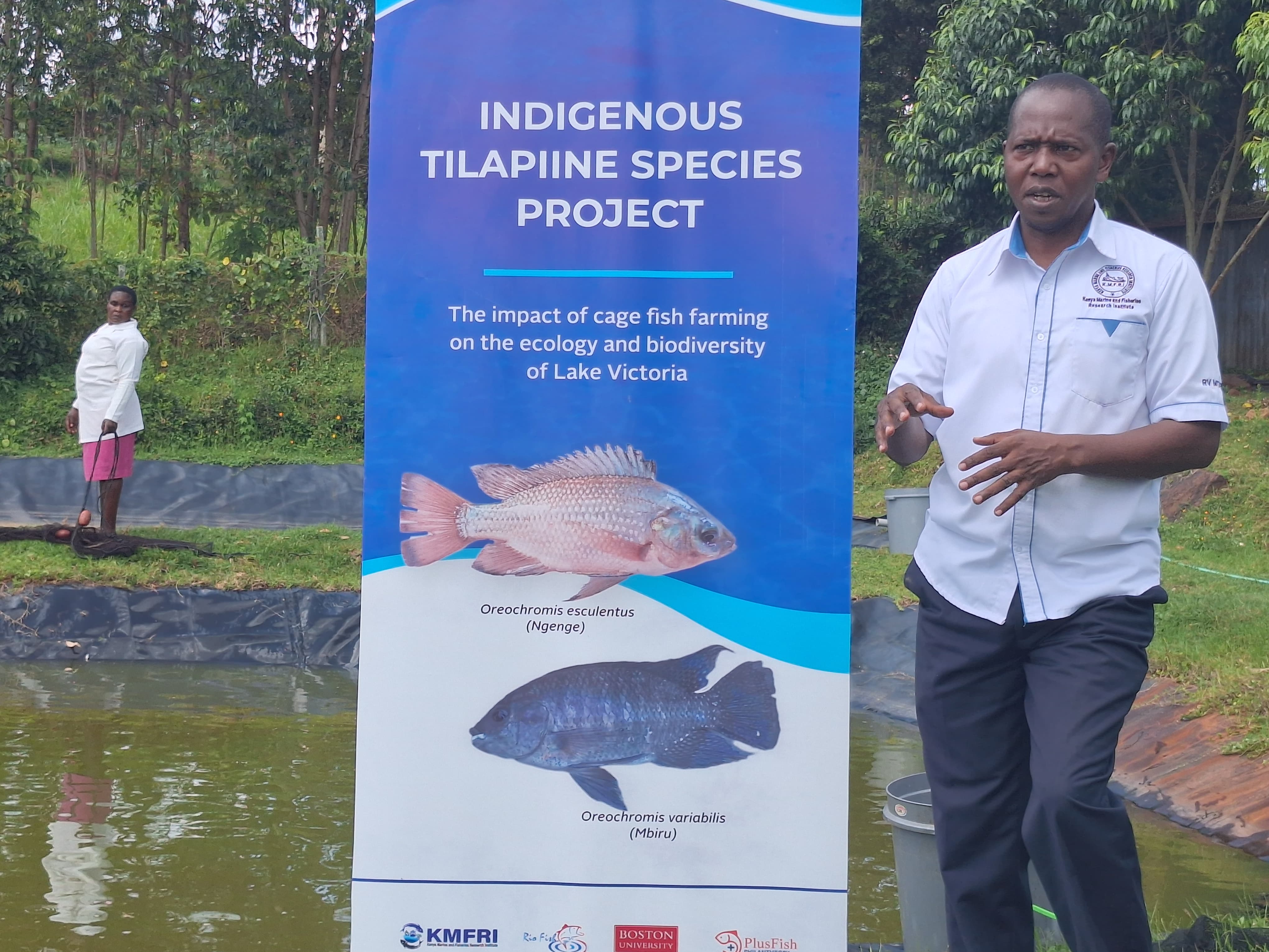 Kenya Marine and Fisheries Research Institute Assistant  Director Aquaculture Dr Paul Orina explaining about fish  species at Kegati Centre in Kisii Central Sub County