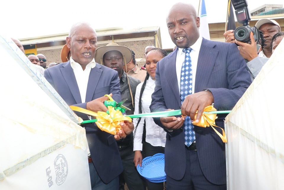 Agriculture CS Dr Andrew Karanja (L) and Bomet Governor Prof Hillary Barchok (R) launched the distribution of 14 pyrethrum dryers to farmers