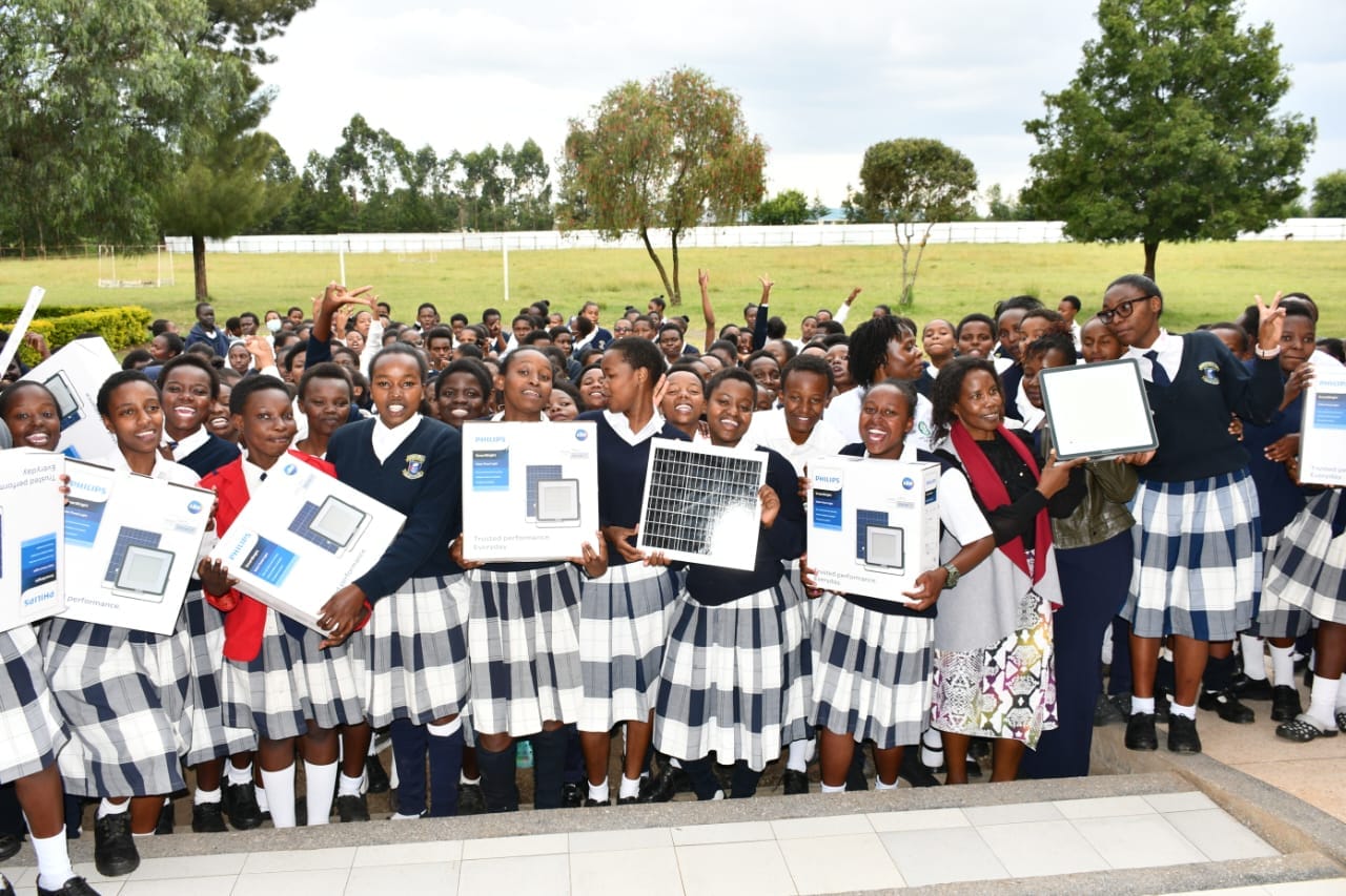 Students of Kirobon Secondary school in Rongai Sub-County celebrate after receiving efficient lighting equipment.