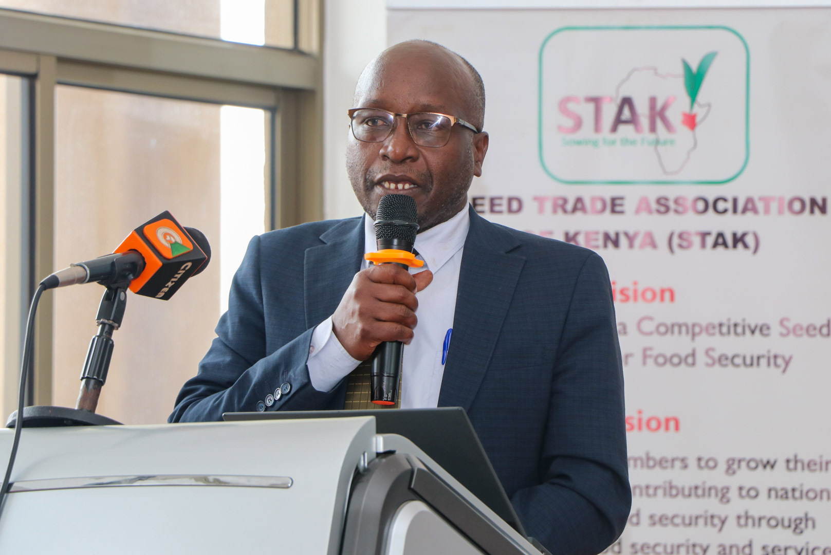 Deputy Director-Crop Resources Management Leonard Kubok reading a speech on behalf of the Agriculture and Livestock Development Cabinet Secretary (CS) Dr. Andrew Karanja during the 12th Seed Trade Association of Kenya (STAK) Congress and Seed Expo