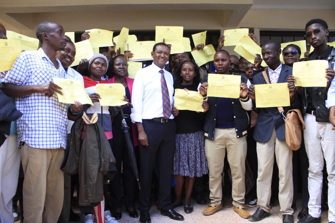 Cabinet Secretary for Labor and Social Protection Dr.Alfred Mutua with some of the residents who have been successfully recruited for various overseas job at the Machakos Institute for the blind. Photo/Allan Maina.