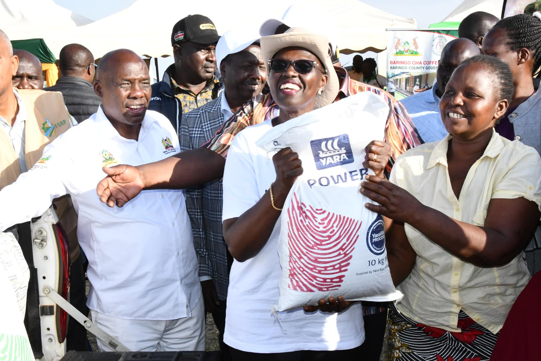 Women in Baringo rejoice after receiving kitchen garden  fertilizer distributed by PS for Agriculture Dr. Paul Ronoh  at Koibatek Agricultural Training Centre in Eldama Ravine: PHOTO/ VINCENT MININGWO