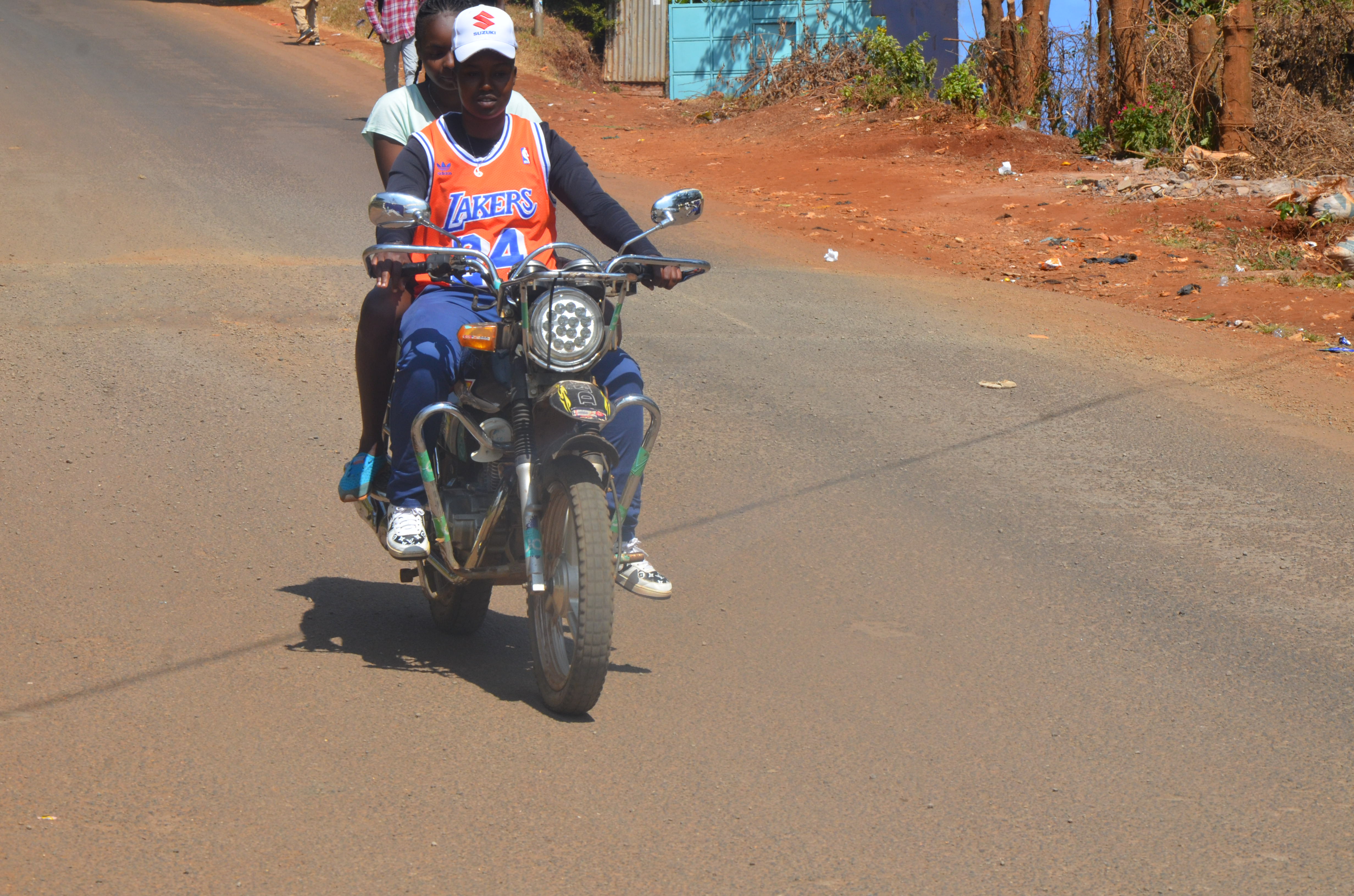 Jackline Wawira ferrying a passenger along Ring Road in downtown Nyeri. The Senate  has drafted a new Bill which aims to regulate the motorcycle transport sector in the  country. PHOTO/KNA