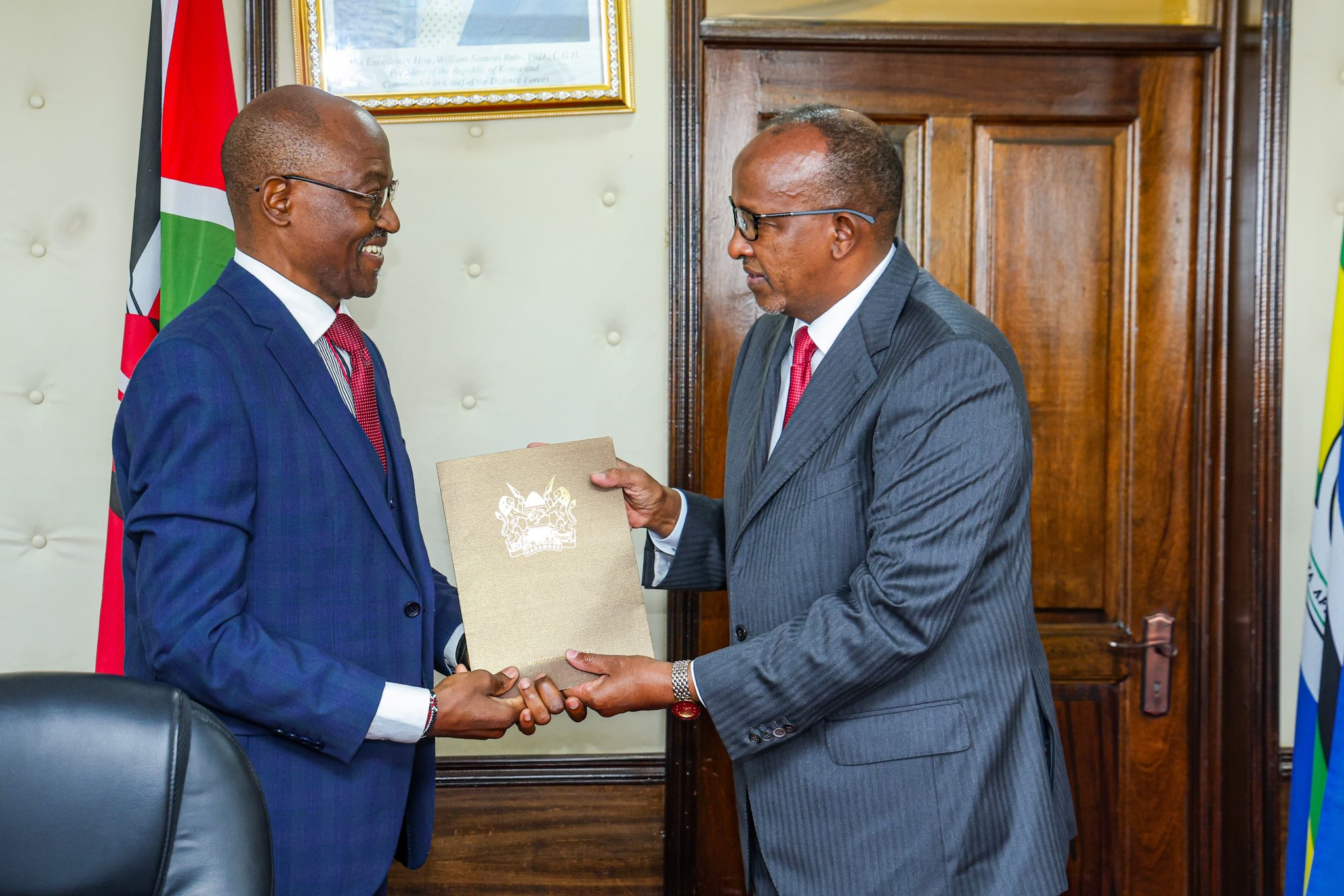 The committee chairperson, James Masiro (L) Cabinet Secretary (CS) for health Hon.Aden Duale(R) during the launch of National Health Insurance Fund (NHIF) pending claims verification committee in Nairobi Afya house