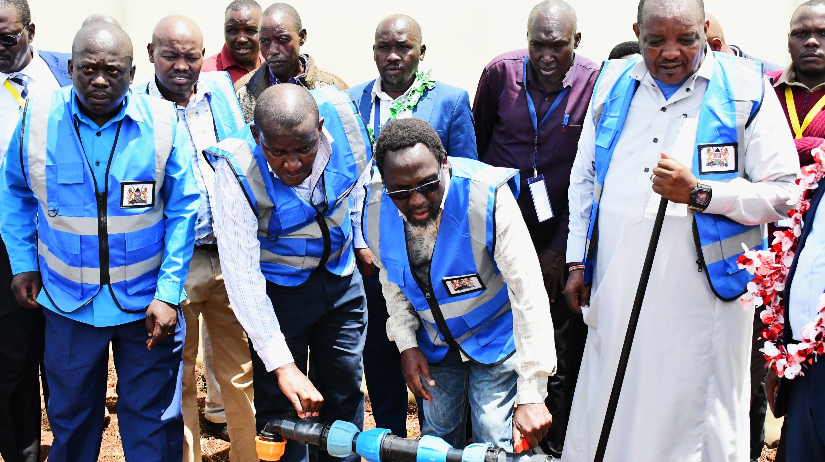  PS Irrigation Ephantus Kimotho (seond right) turns on water to commission a new Micro Irrigation for Schools project in Barwessa, Baringo County. Photo/Christopher Kiprop