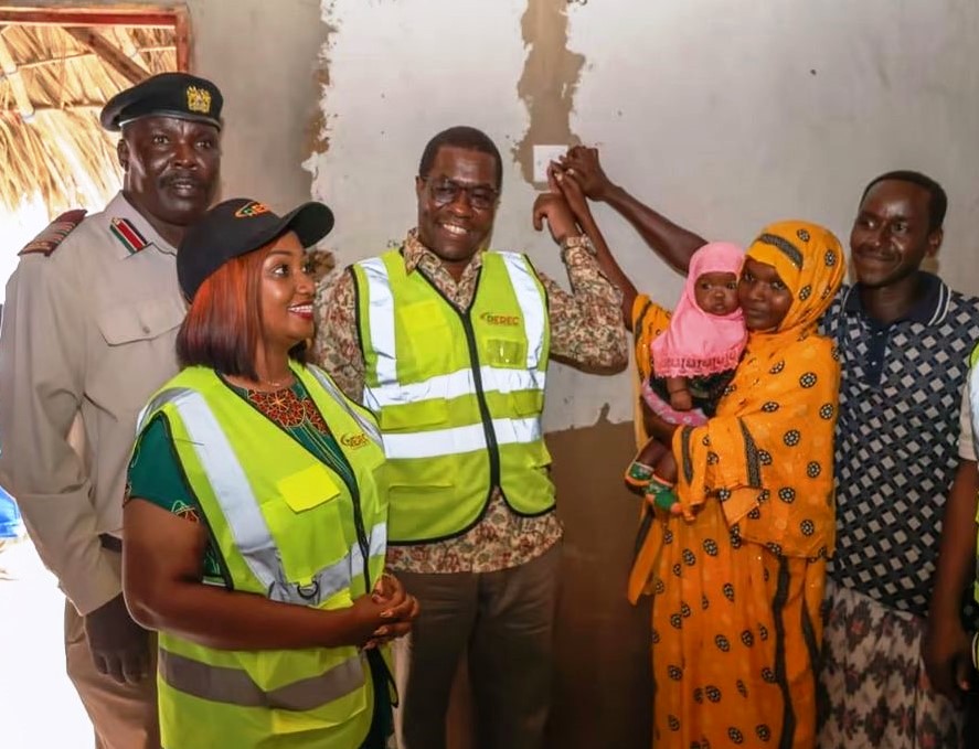 Energy and Petroleum Cabinet Secretary Opiyo Wandayi lights up electricity in a house in Gubani village Garsen constituency of Tana River.