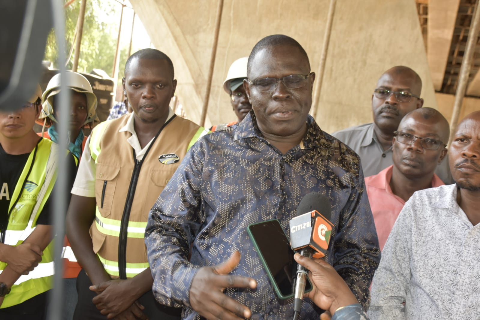 North Eastern Regional Commissioner John Otieno addressing the press after touring the ongoing construction of the Sh1.7 billion Tana bridge.