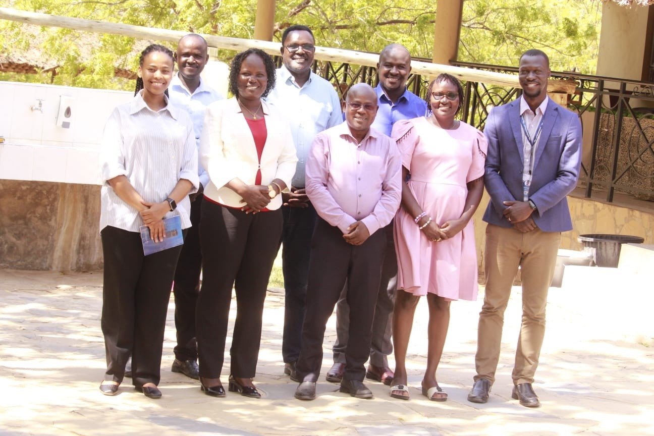 Turkana County Deputy Governor Dr John Erus (centre,front row) and officials from Swisscontact after a meeting to deliberate strategies to build capacity of local community to ensure they benefit from opportunities in the oil and gas sector. PHOTO: PETER GITONGA