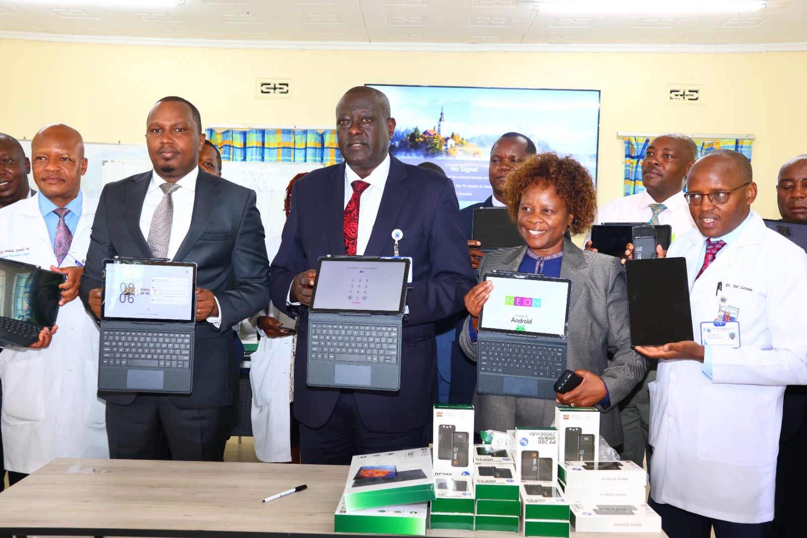 Kenyatta National Hospital Chief Executive Officer (CEO) Dr. Richard Lesiyampe (Centre) together with officials from the Digital Health Authority and Kenyatta National Hospital staff display the new digital health system known as the Taifa Afya Apex platform during its launch in Nairobi.