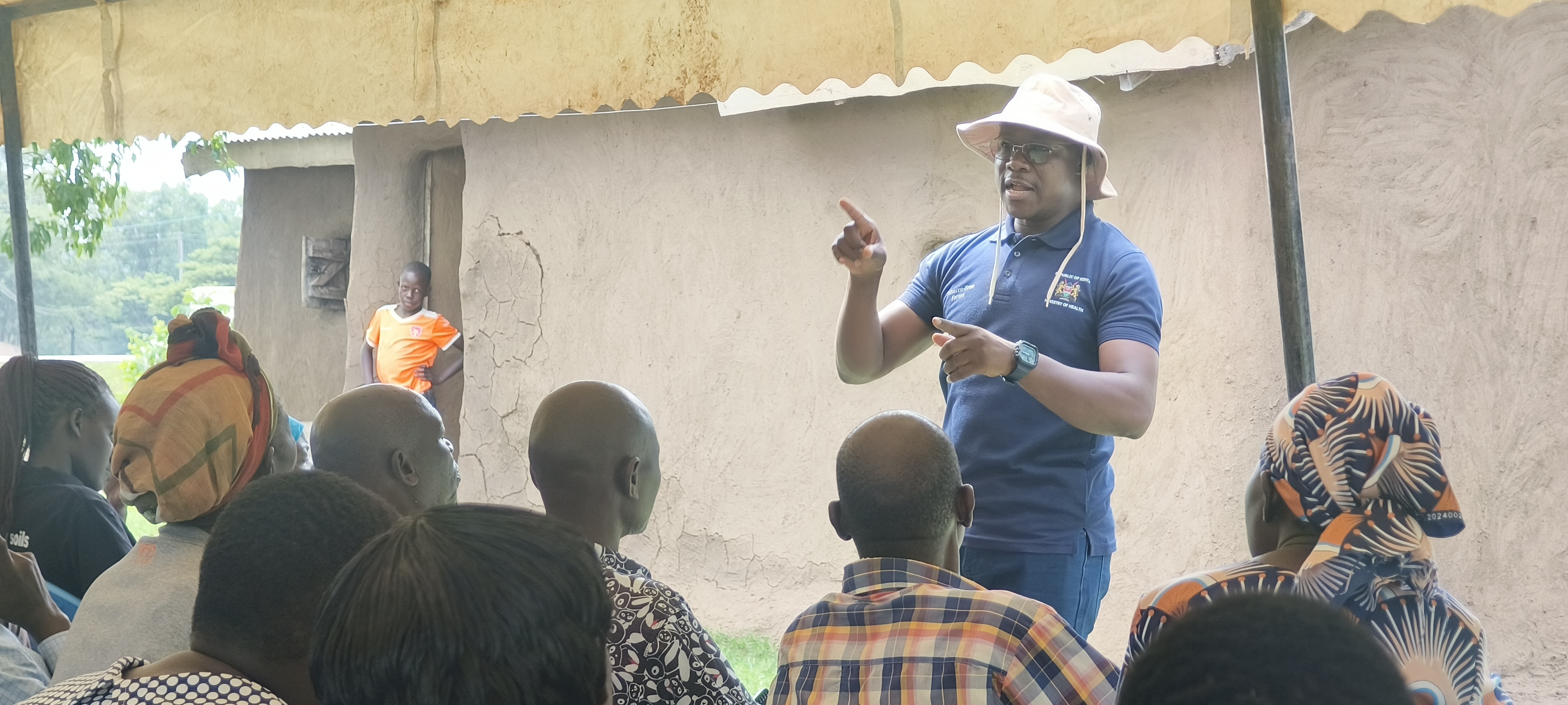 Cereal Growers Association (CGA) Agribusiness Coordinator for Busia County Eliya Barasa speaking to farmers during a farmer’s demonstration at Ikapolok, Amagoro, Teso North SubCounty. PHOTO: MOSES WEKESA