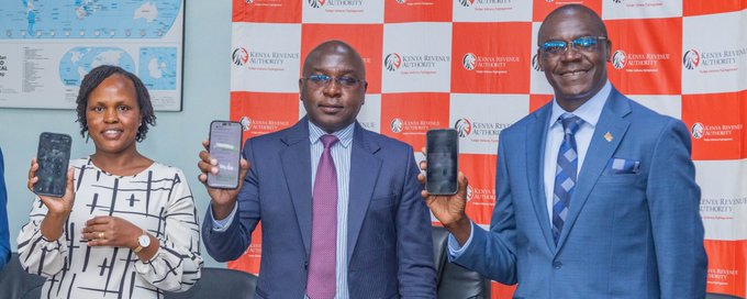 Kenya Revenue Authority (KRA) Commissioner General Humphrey Wattanga (Center) during the launch of the WhatsApp-based tax filing solution.
