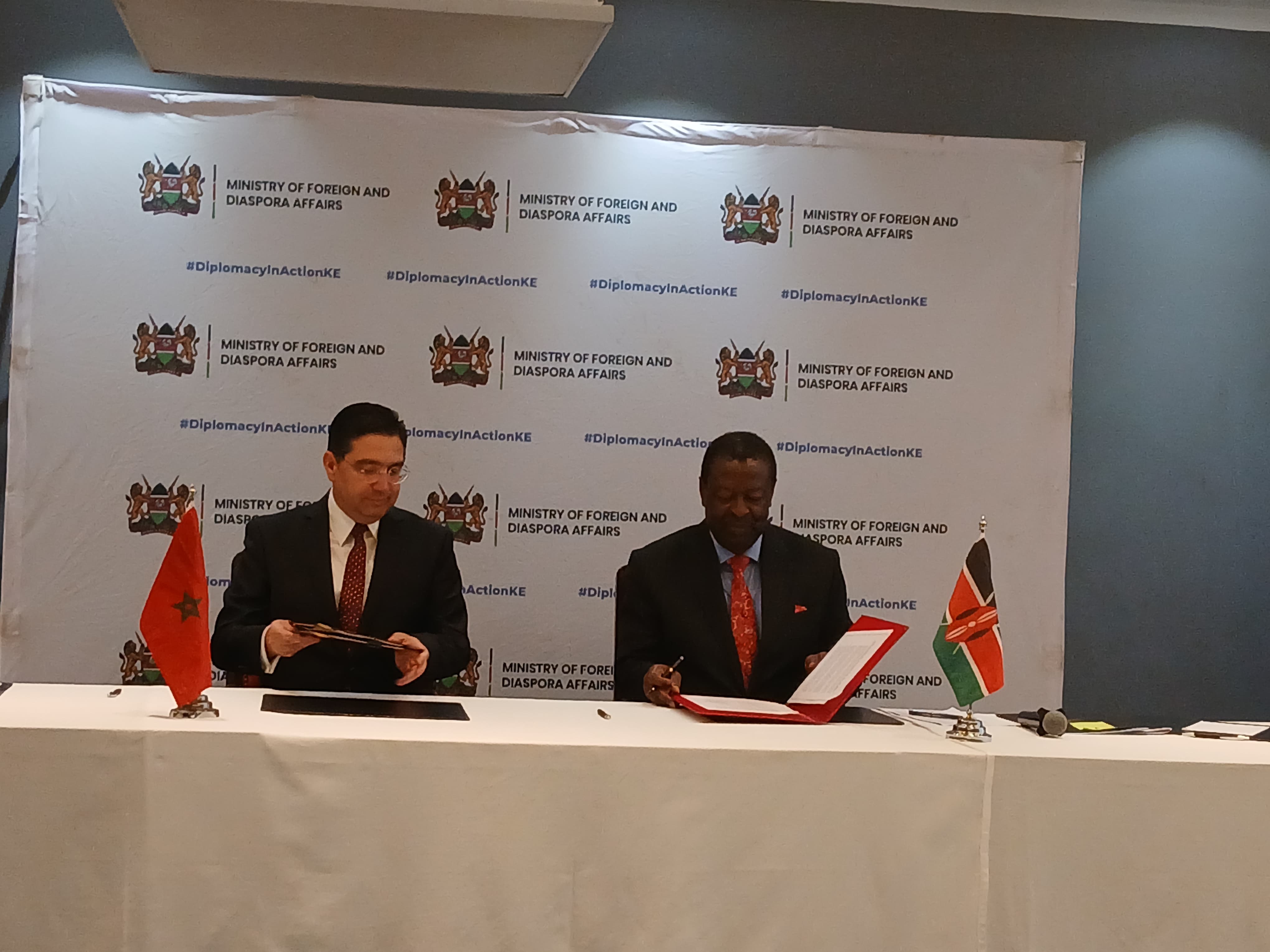 Prime Cabinet Secretary (CS) and Cabinet Secretary for Foreign and Diaspora Affairs Musalia Mudavadi (Right) with his counterpart the Minister of Foreign Affairs of the Kingdom of Morocco Nasser Bourita sign the agreed minutes, MoUs and joint communique during the Inaugural Joint Commission for Cooperation (JCC) between the Republic of Kenya and the Kingdom of Morocco in Nairobi. 