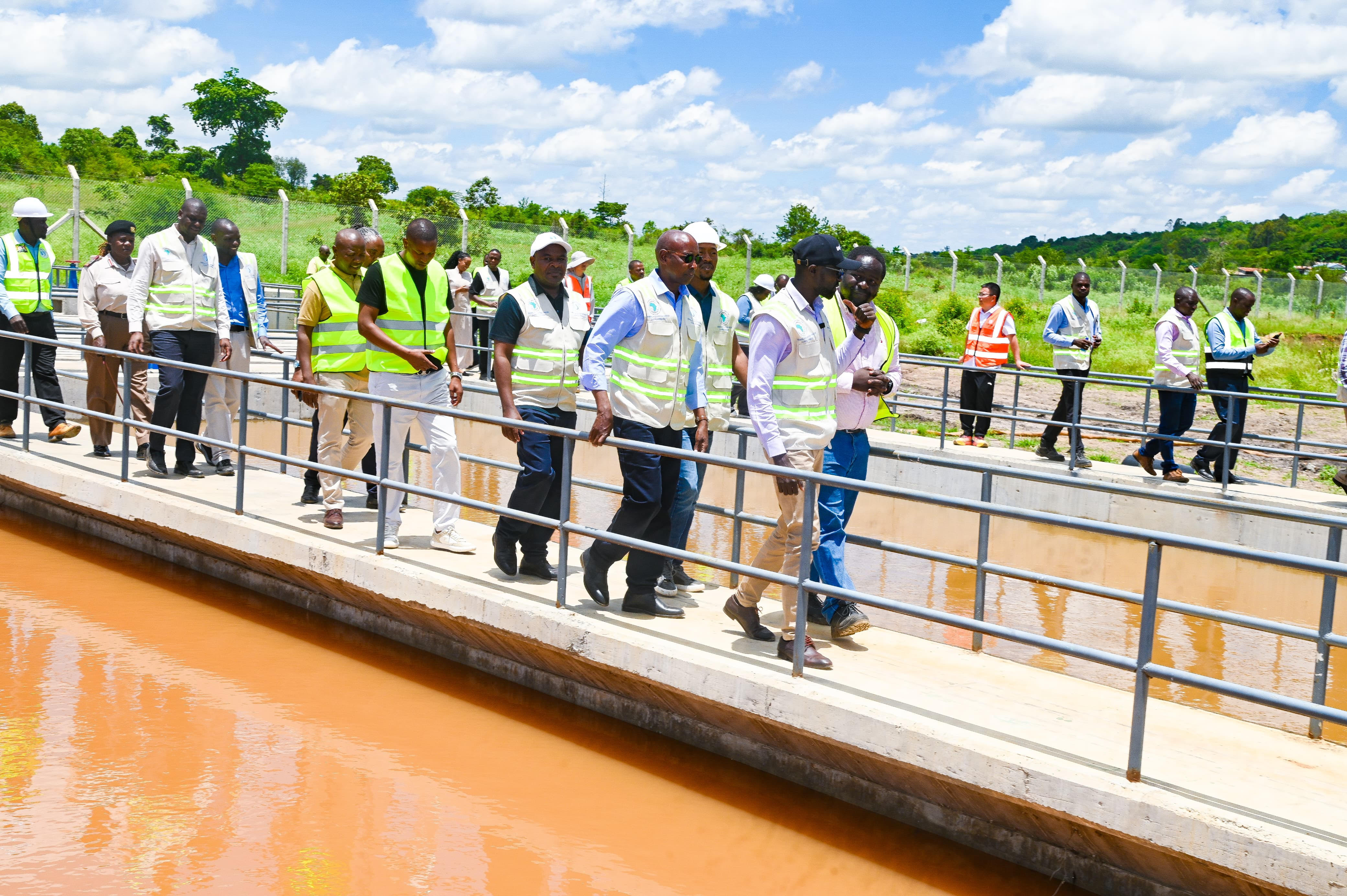Water, Sanitation and Irrigation Cabinet Secretary Eng Eric Muriithi Mugaa, leading the team, (in a black cap) accompanied by Tanathi CEO Sammy Naporos and Mwala MP Vincent Musyoka during the inspection of ongoing Mwala Cluster Water Project in Machakos County.
