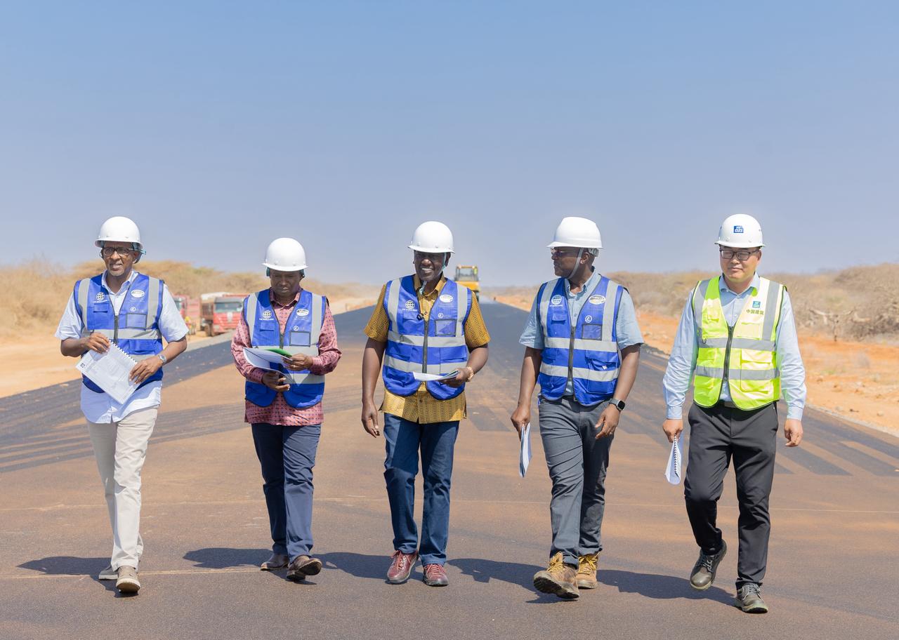 President William Ruto(middle) flanked by Deputy President Kithure Kindiki Health CS Aden Duale and contractor along the Isiolo–Mandera road