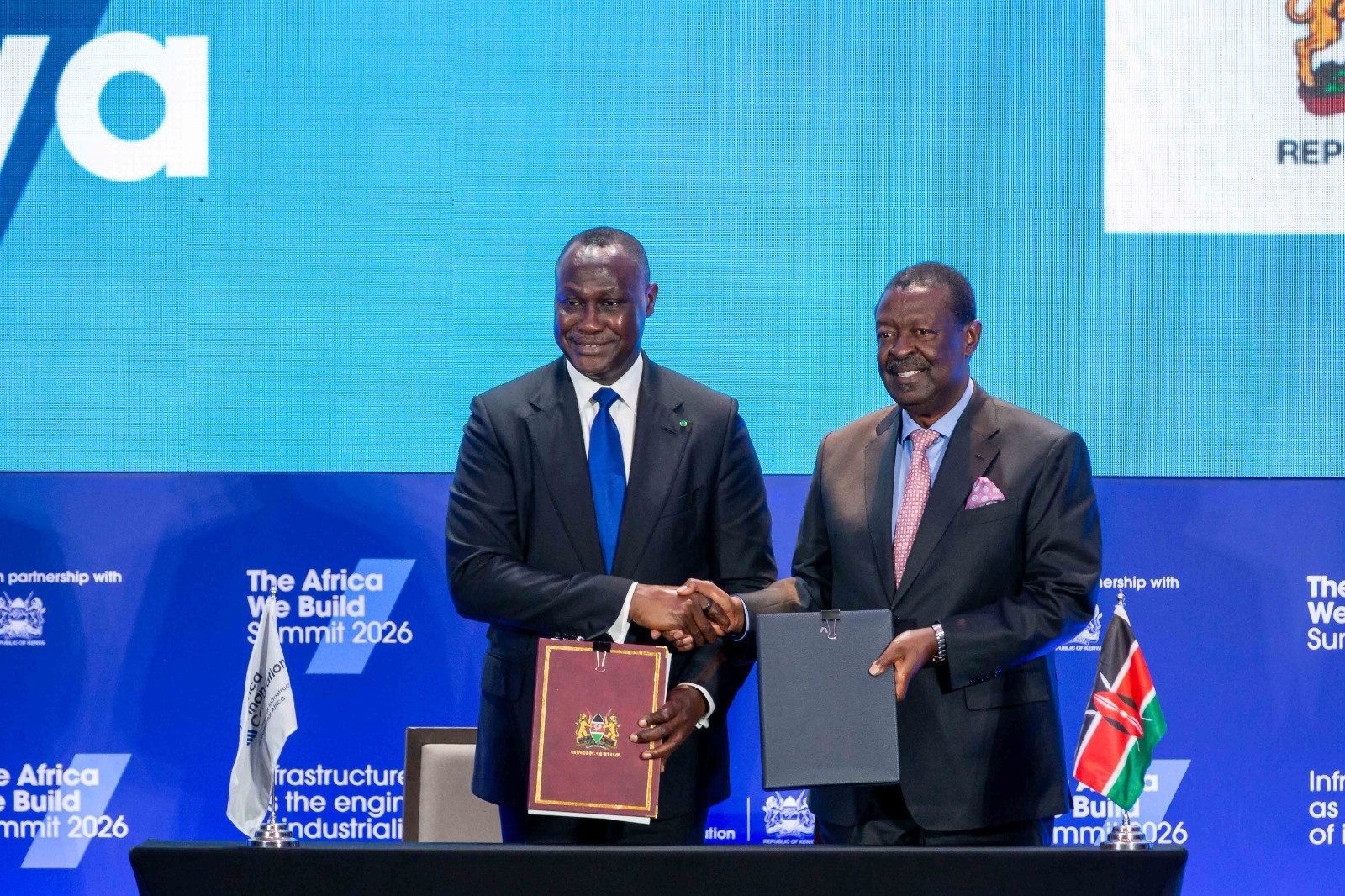 Prime Cabinet Secretary and Cabinet Secretary for Foreign and Diaspora Affairs, Musalia Mudavadi (right), and AFC President and Chief Executive Officer, Samaila Zubairu, during the signing of an agreement at the Africa We Build Summit in Nairobi.