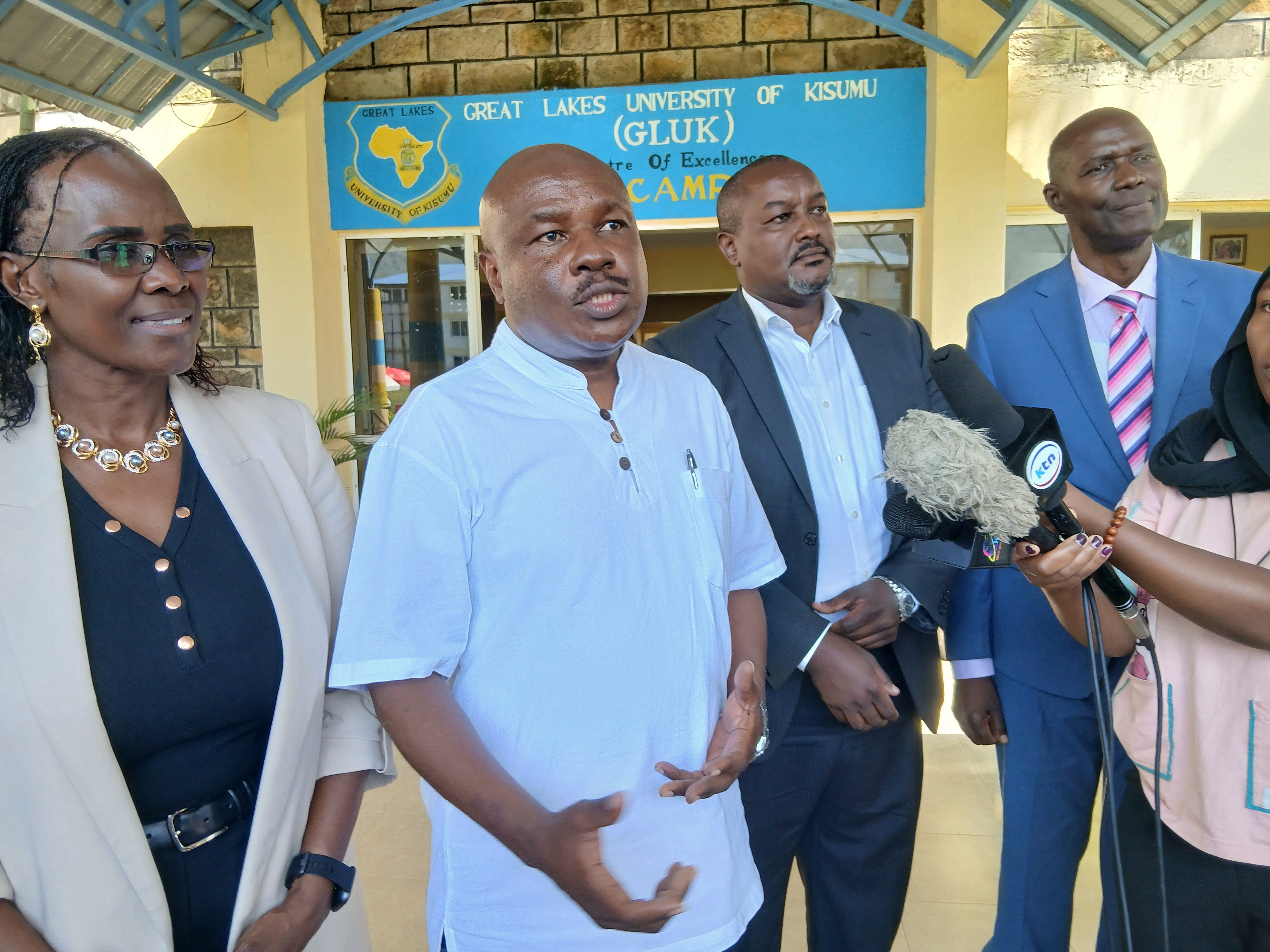 Labour and Skills Development Principal Secretary Shadrack Mwadime (Second Left), addressing the media at Great Lakes University of Kisumu (GLUK). PHOTO: CHRIS MAHANDARA