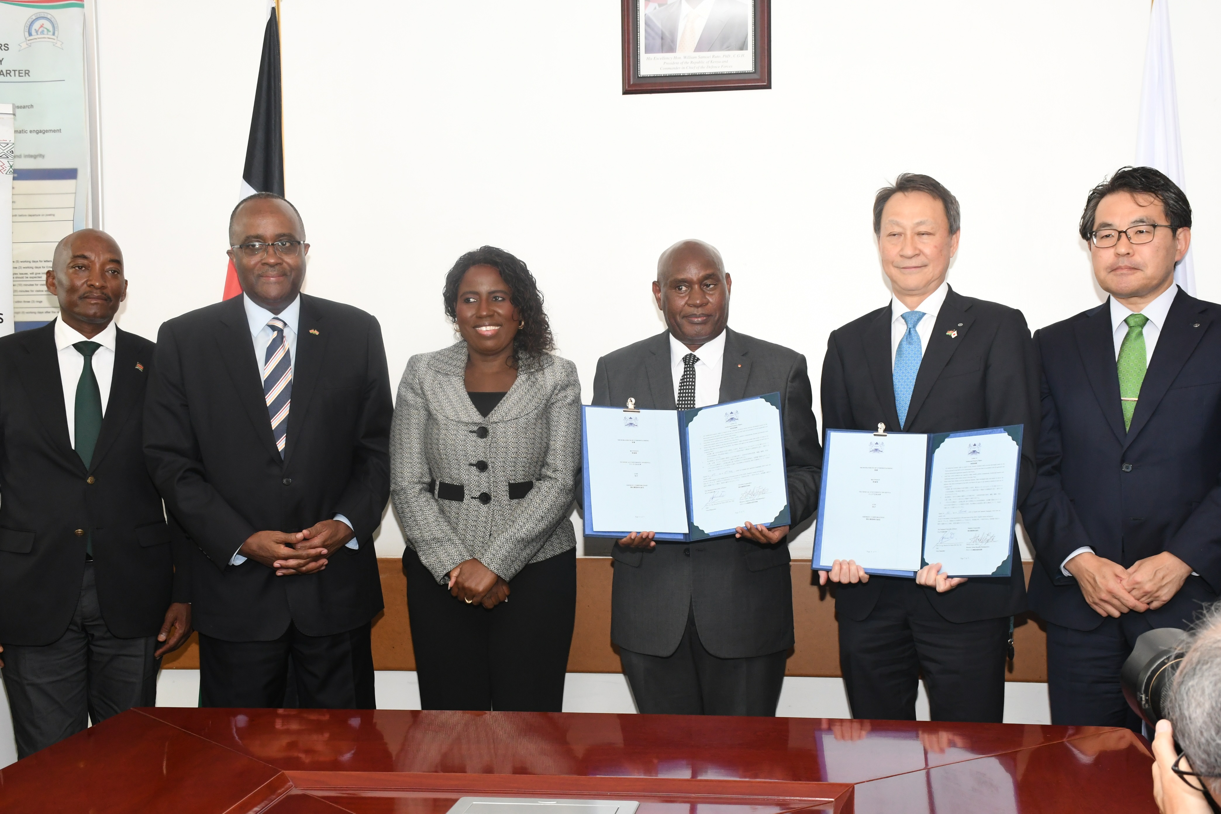 Principal Secretary, State Department for Higher Education and Research Beatrice Inyangala (third from left) with officials from the Technical University of Kenya and Shimizu Corporation of Japan posing for a group photo after the official signing of a Memorandum of Cooperation between Shimizu Corporation of Japan and two Kenyan Universities in Nairobi. PHOTO: ARON KINYAMASYO/KNA