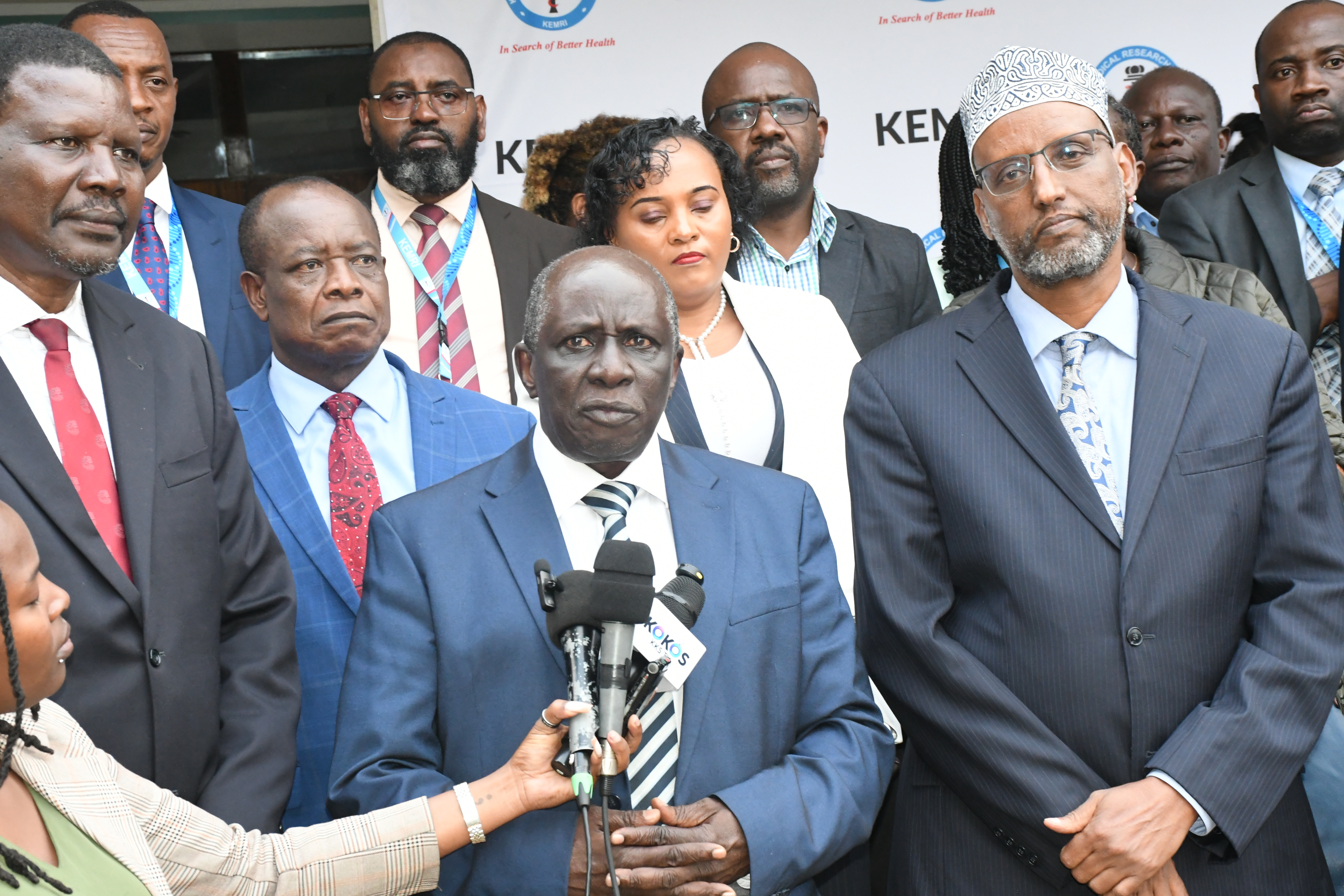 The National Assembly Departmental Committee on Health Chairperson, Dr. James Nyikal, addresses the media in Nairobi after undertaking a fact-finding visit to the Kenya Medical Research Institute (KEMRI) Multi-Phase Laboratories, Training and office facility, currently under construction at the Kenyatta National Hospital Complex. He is flanked by other members of the Committee (Back), KEMRI Director General and Ag. Vice Chancellor Prof. Elijah Songok (Left), and KEMRI’s Board of Directors, Dr Abdullahi Ali 