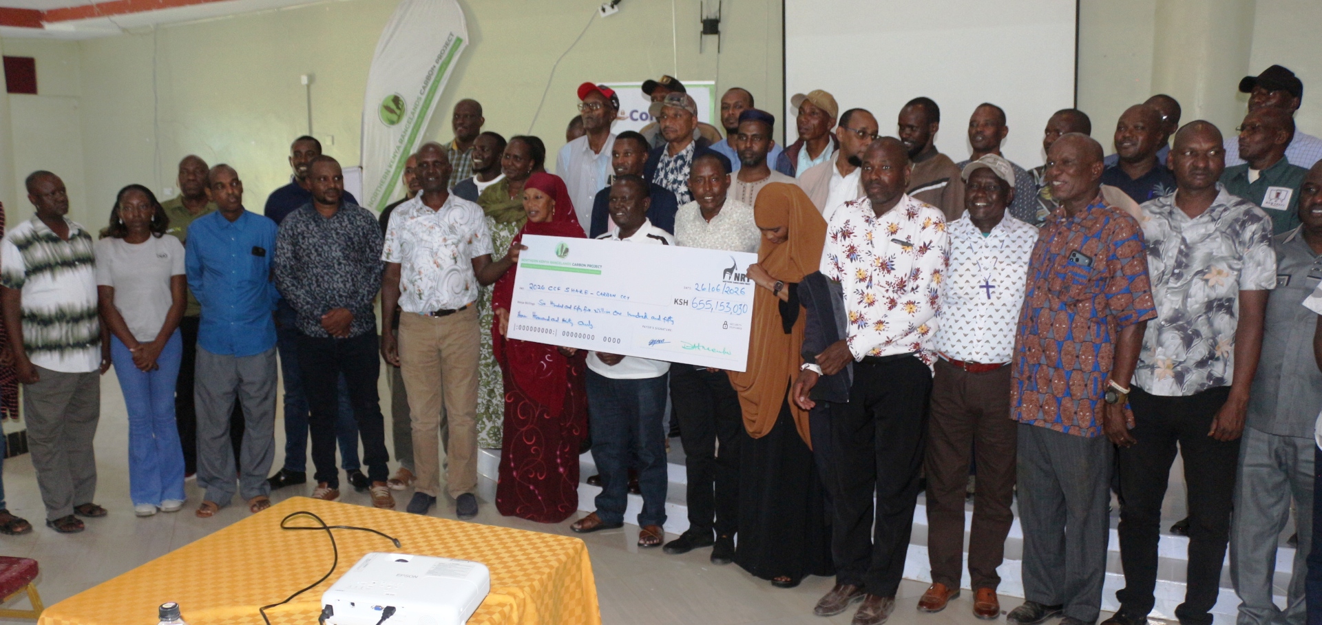 Presentation of a dummy cheque for pastoralist communities from four counties in northern Kenya who have received Sh 655 million in carbon credit earnings under a community-led rangeland conservation programme