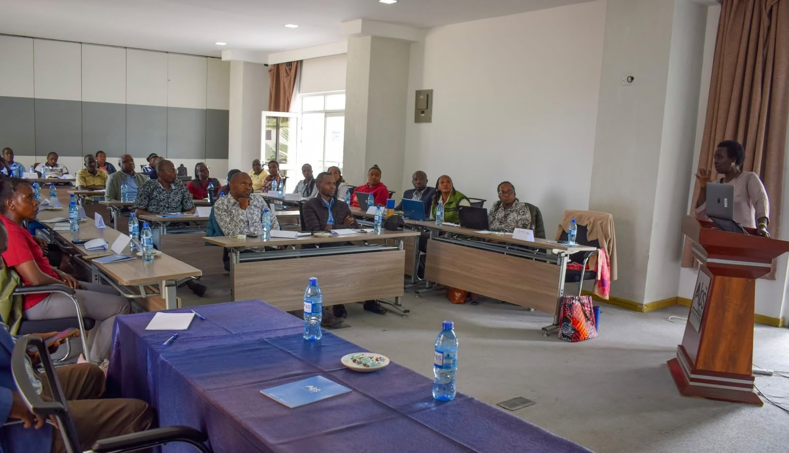 Agritech/County agricultural extension officers, researchers, and stakeholders follow a presentation during the VarScout platform review meeting in Nakuru. 