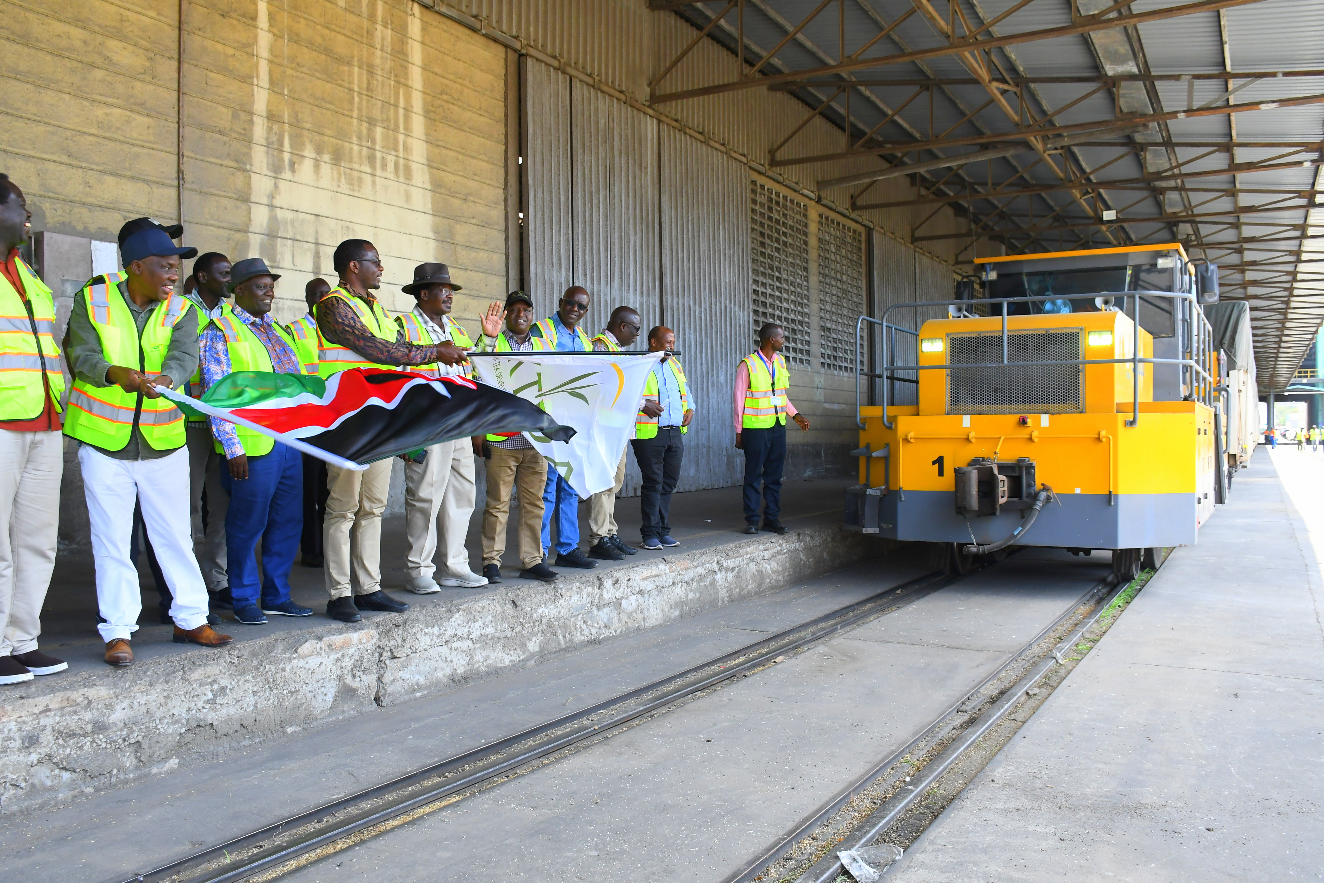 Principal Secretary (PS) for Agriculture, Dr Kiprono Ronoh, and Kenya Tea Development Agency (KTDA) Chairman Enos Njeru inspect part of the 30,000 metric tonnes of fertilizer at the Port of Mombasa