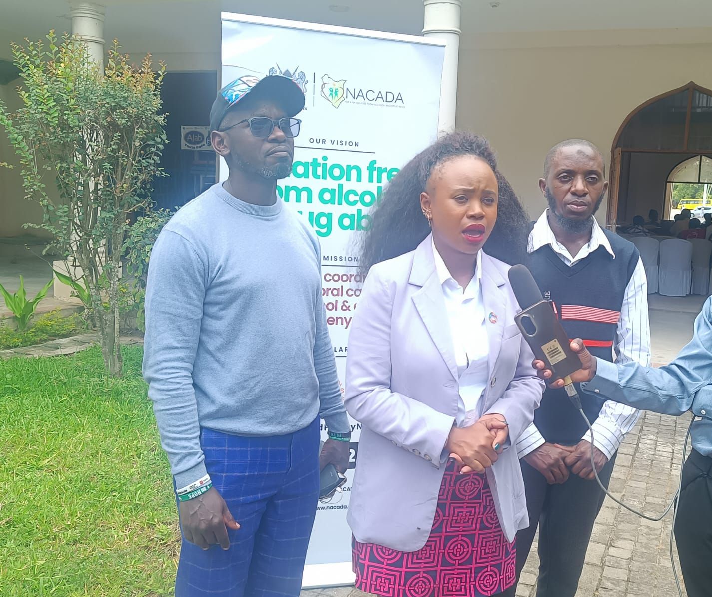 Youth representative Ruth Machocho briefs the press during the opening of the youth summit on drug and crime prevention in Mombasa, flanked by other participants at the venue.