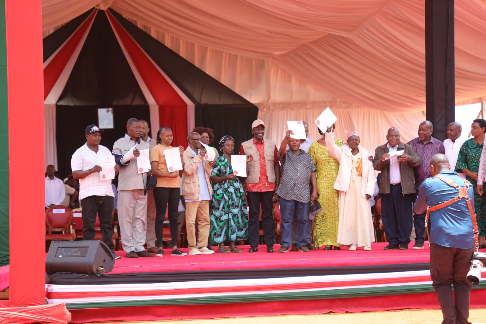 President William Roto (sixth left) with a section of beneficiaries during the issuance of more than 31,000 title deeds to residents of Taita Taveta County.