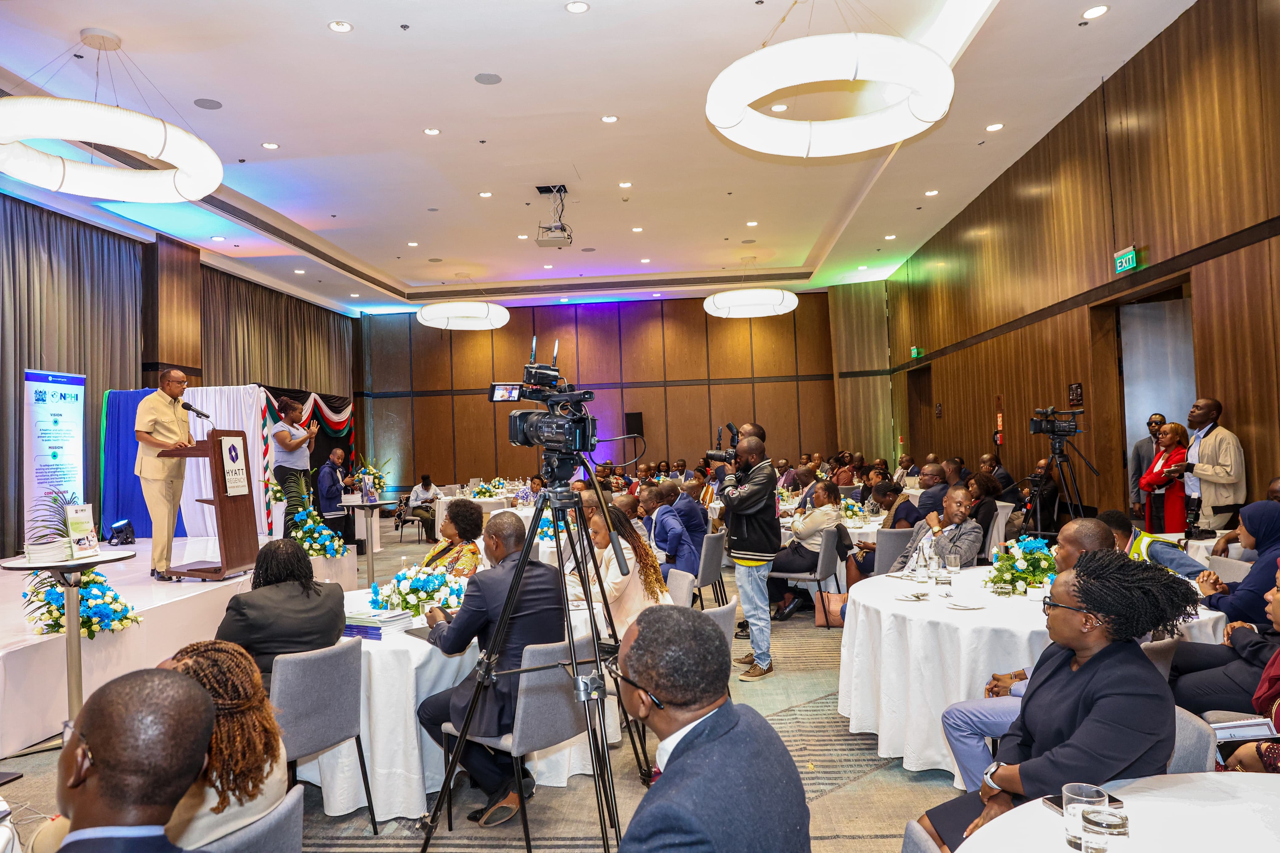 Mary Muthoni, Principal Secretary for Public Health and Professional Standards; Festus K. Ng’eno, Principal Secretary for Environment and Climate Change; Neema Rusibamayila Kimambo, WHO Acting Country Representative; John Kariuki, Chairperson of the Kenya National Public Health Institute Board; Kamene Kimenye, Acting Director-General of the Kenya National Public Health Institute; alongside representatives from Africa CDC, development partners, and stakeholders from national and county governments.