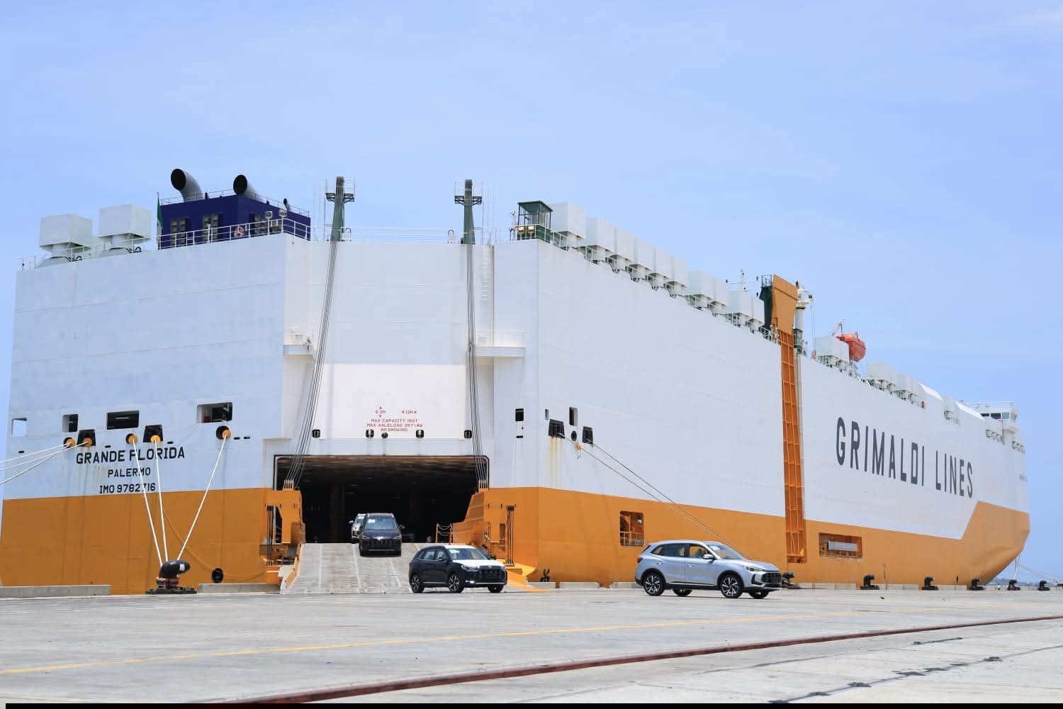 Vehicles disembark from a cargo ship at the port of Lamu that is emerging as a transshipment hub