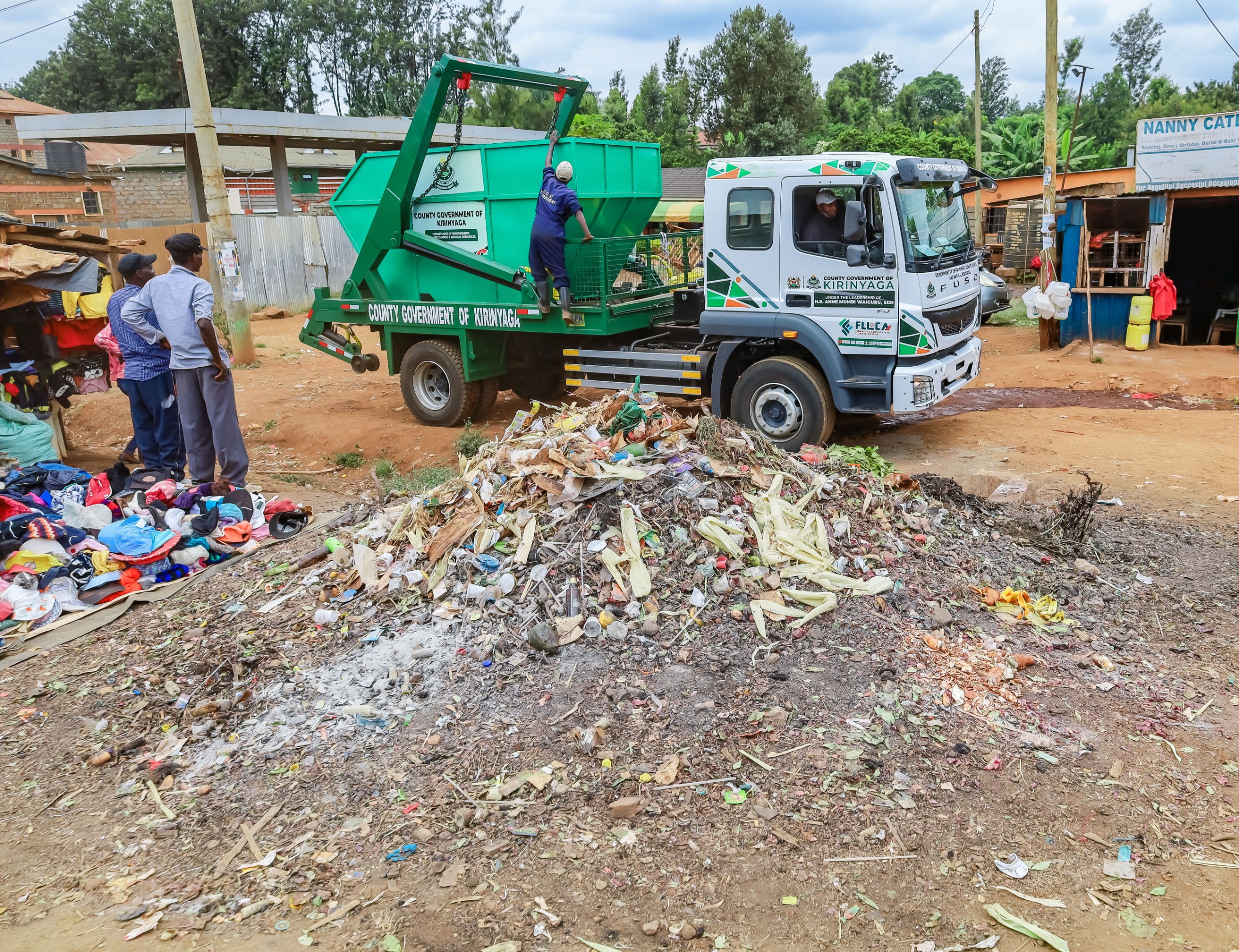 A Kirinyaga County Government truck offloading a new skip in market