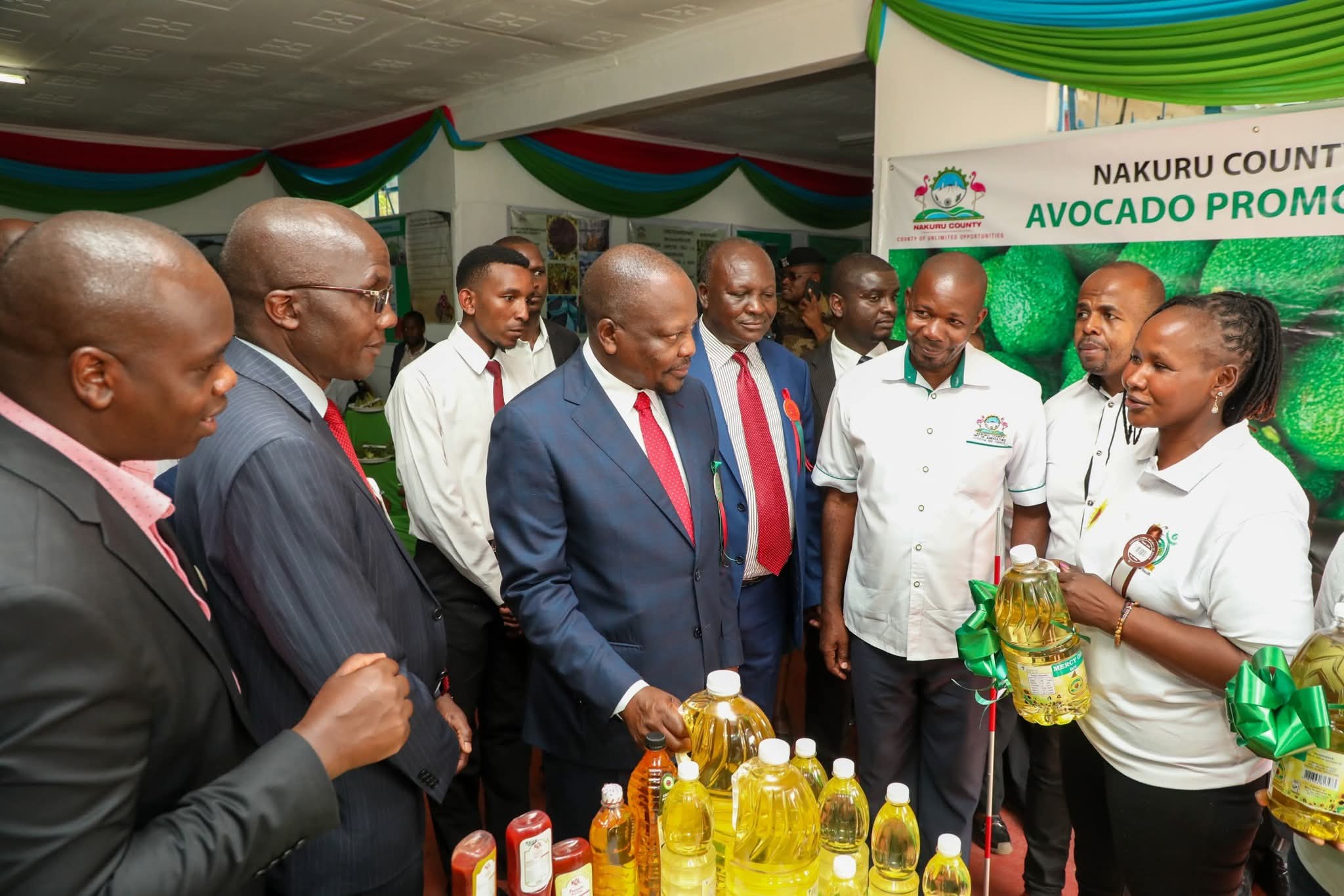 CS Mutahi Kagwe (right) is taken round the Nakuru Show by Nakuru Deputy Governor Dr David Kones (left)
