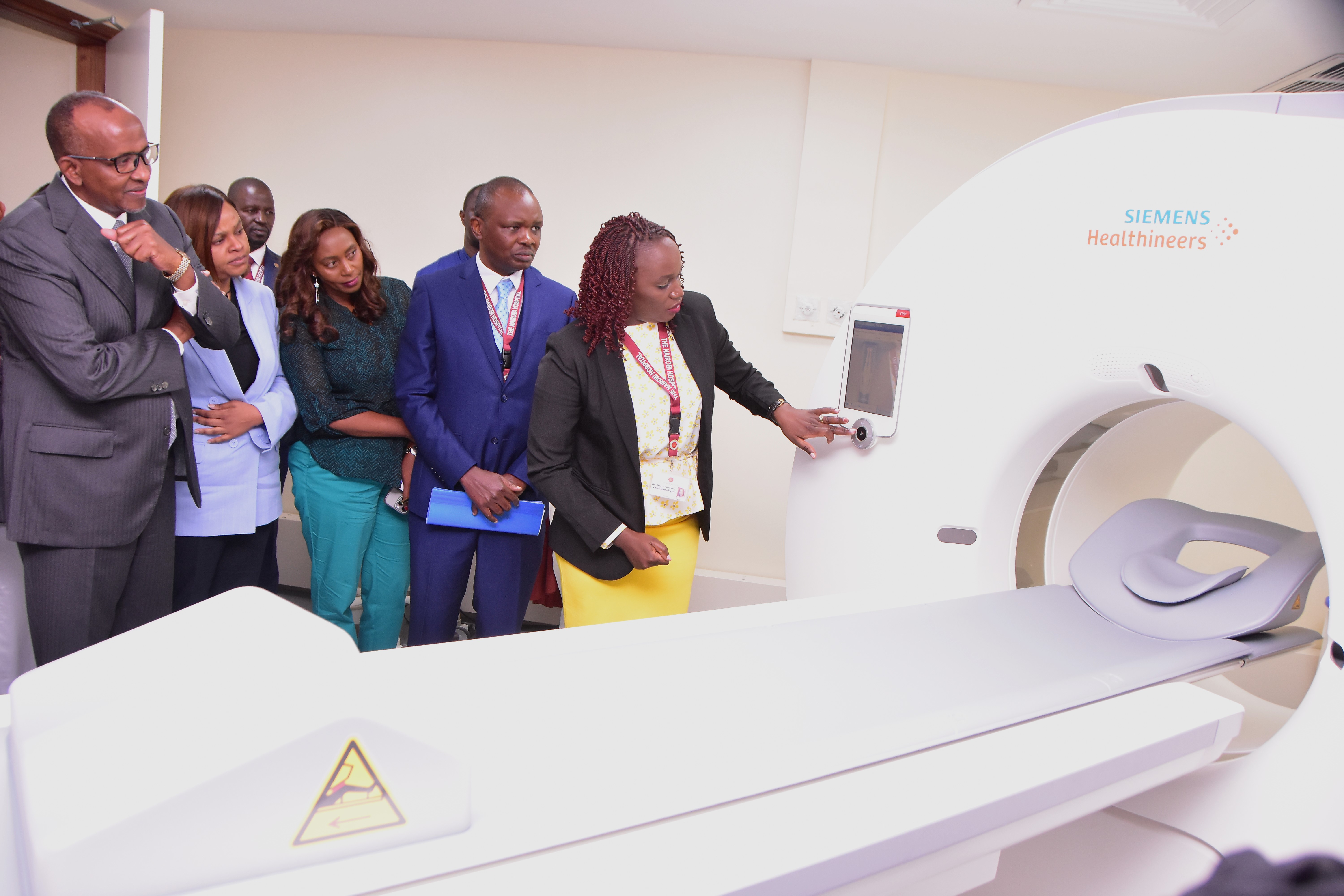 The AI-Powered CT Scanner being given a test run by the hospital’s Chief Radiologist as the Health Cabinet Secretary Aden Duale (Far L) looks on