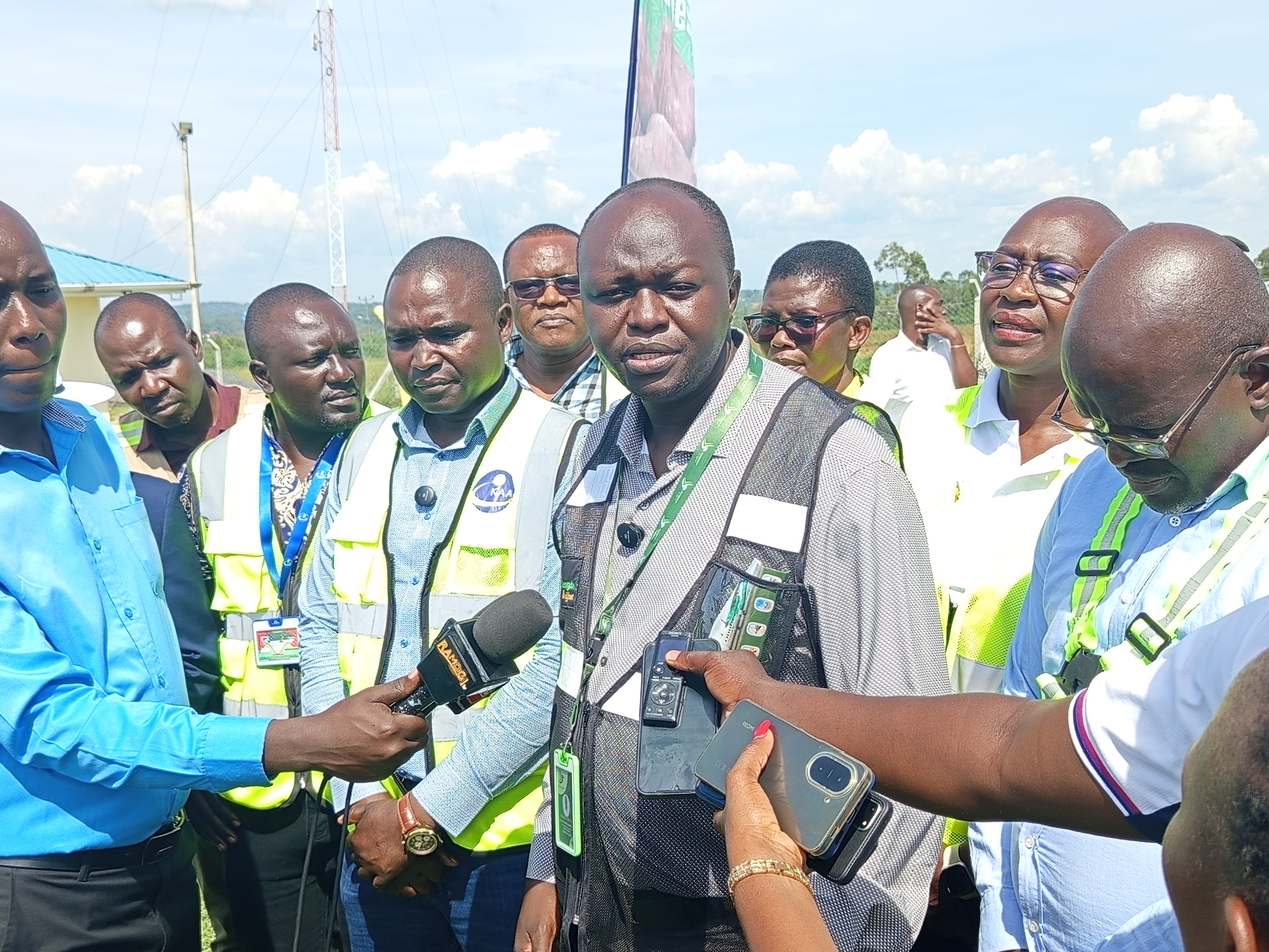 Patrick Oketch, the In-charge of Sales and Marketing at Renegade Air and other officials from both Renegade Air and Homa Bay County government speaks to the press during the official opening of the renovated Kabunde airstrip runway. PHOTO: SITNA OMAR-KNA