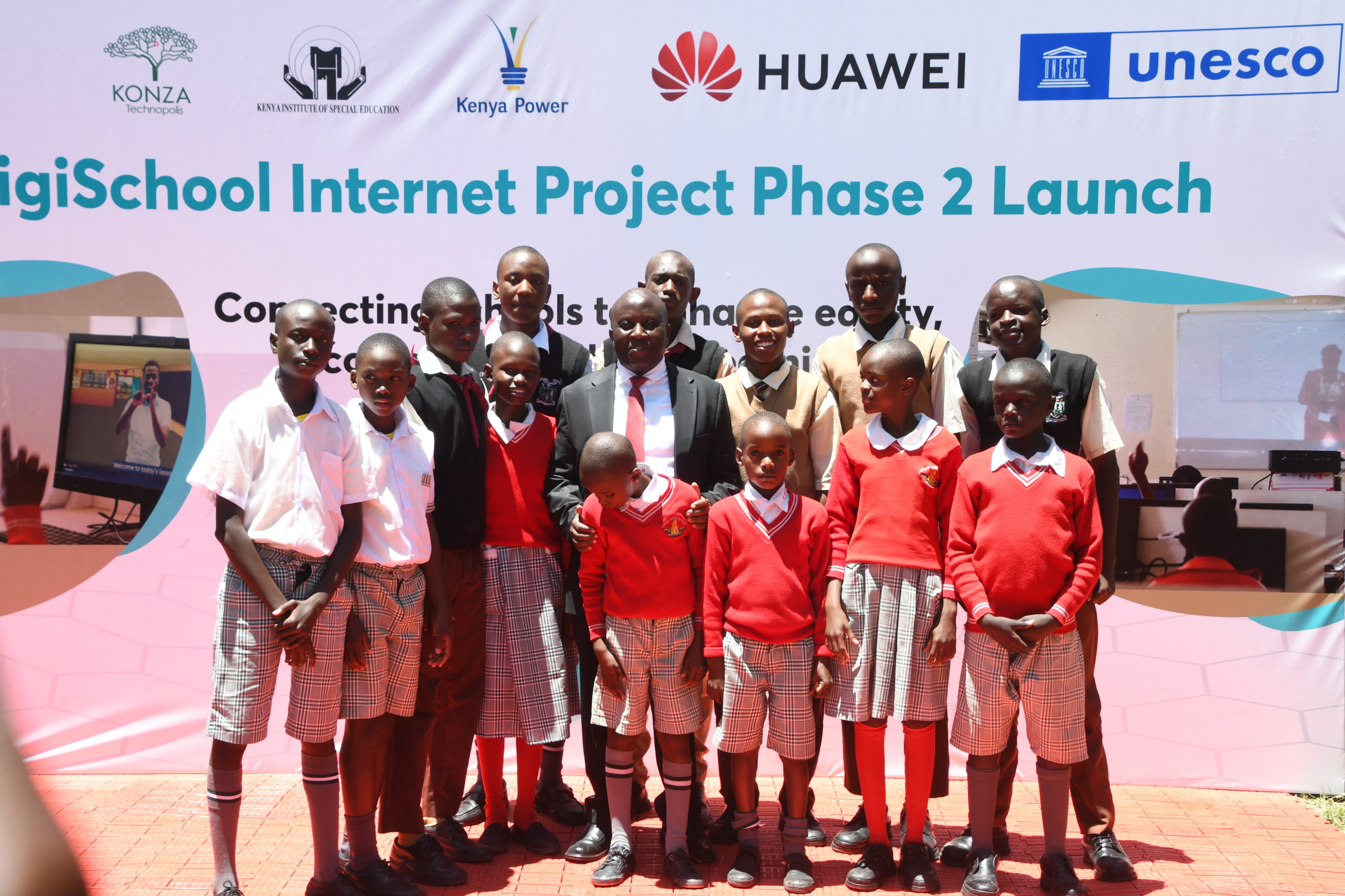 Principal Secretary for ICT Engineer John Tanui in the middle with pupils from the Machakos school for the deaf at the launch of phase two Digischool internet project.Photo by Tabitha Ndanu