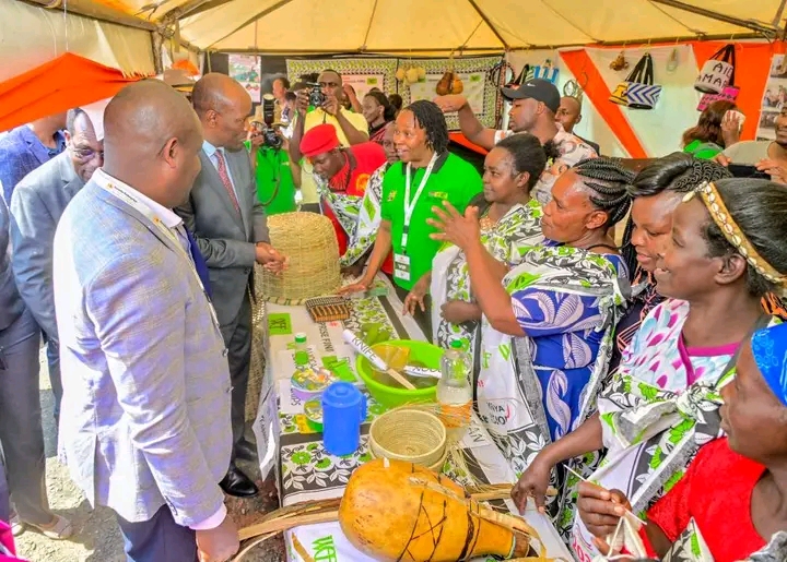 Investments, Trade and Industry CS Lee Kinyanjui, interacts with MSME exhibitors and listens to their presentations during the opening of the Investment Summit at Kiprugut Chumo Stadium in Kericho Town.