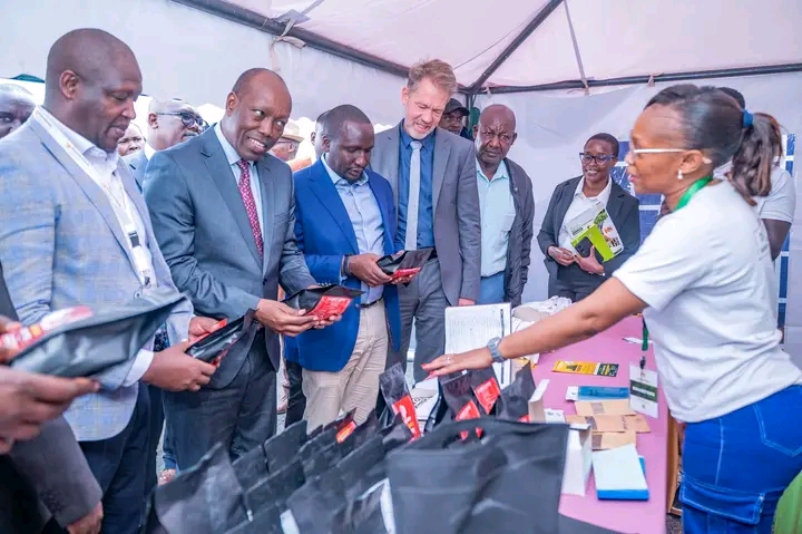 Investments, Trade and Industry CS Lee Kinyanjui, interacts with MSME exhibitors and listens to their presentations during the opening of the Investment Summit at Kiprugut Chumo Stadium in Kericho Town.