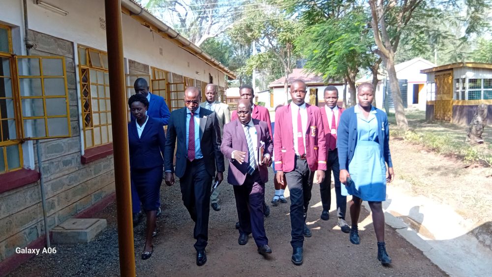 The Kenya Medical Training CEO Dr. Kelly Oluoch (red  tie) during a routine visit to KMTC Bondo campus.