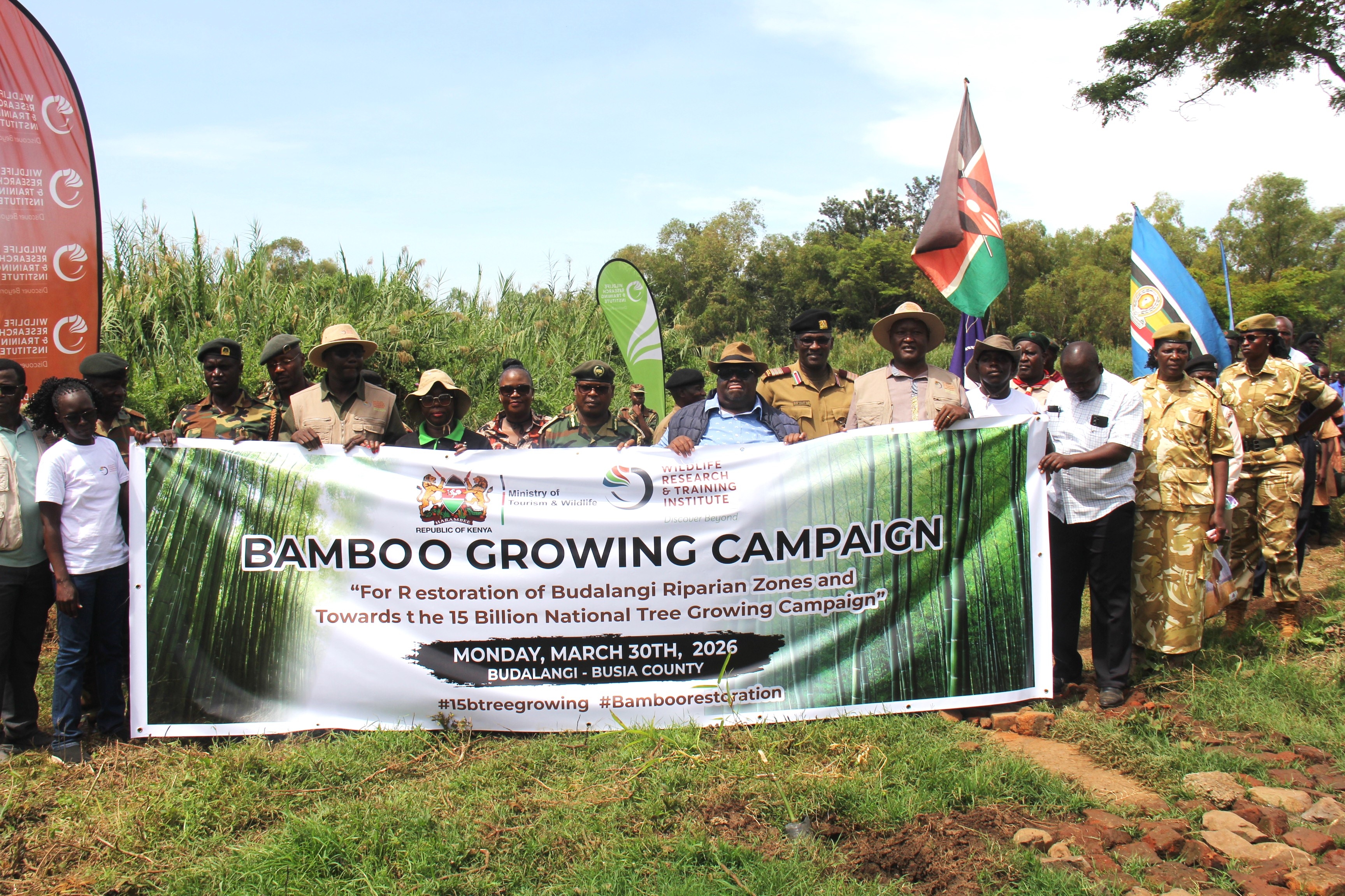 Wildlife Conservation Secretary John Chumo planting a bamboo tree in Budalang'i. He said the initiative is aimed at rehabilitating degraded riverbanks and protecting communities living in flood-prone areas