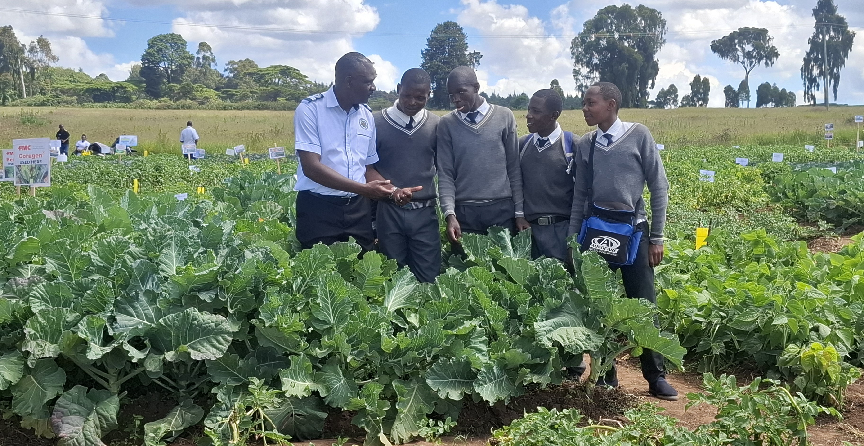 Charles Lusweti, Head of the Youth in Agriculture Unit within Kenya's Ministry of Agriculture and Livestock Development together with the 4K club students at the Egerton University