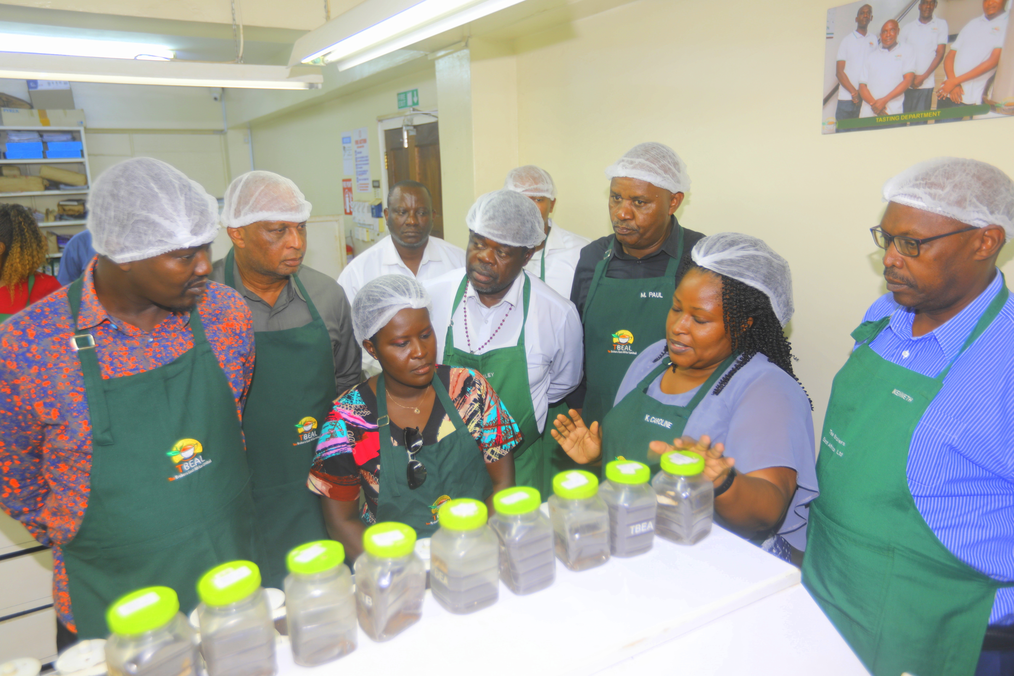 A section of the Senate Standing Committee members on Trade, Industrialization and  Tourism members sample tea at the Mombasa tea auction.  Photo/Andrew Hinga.