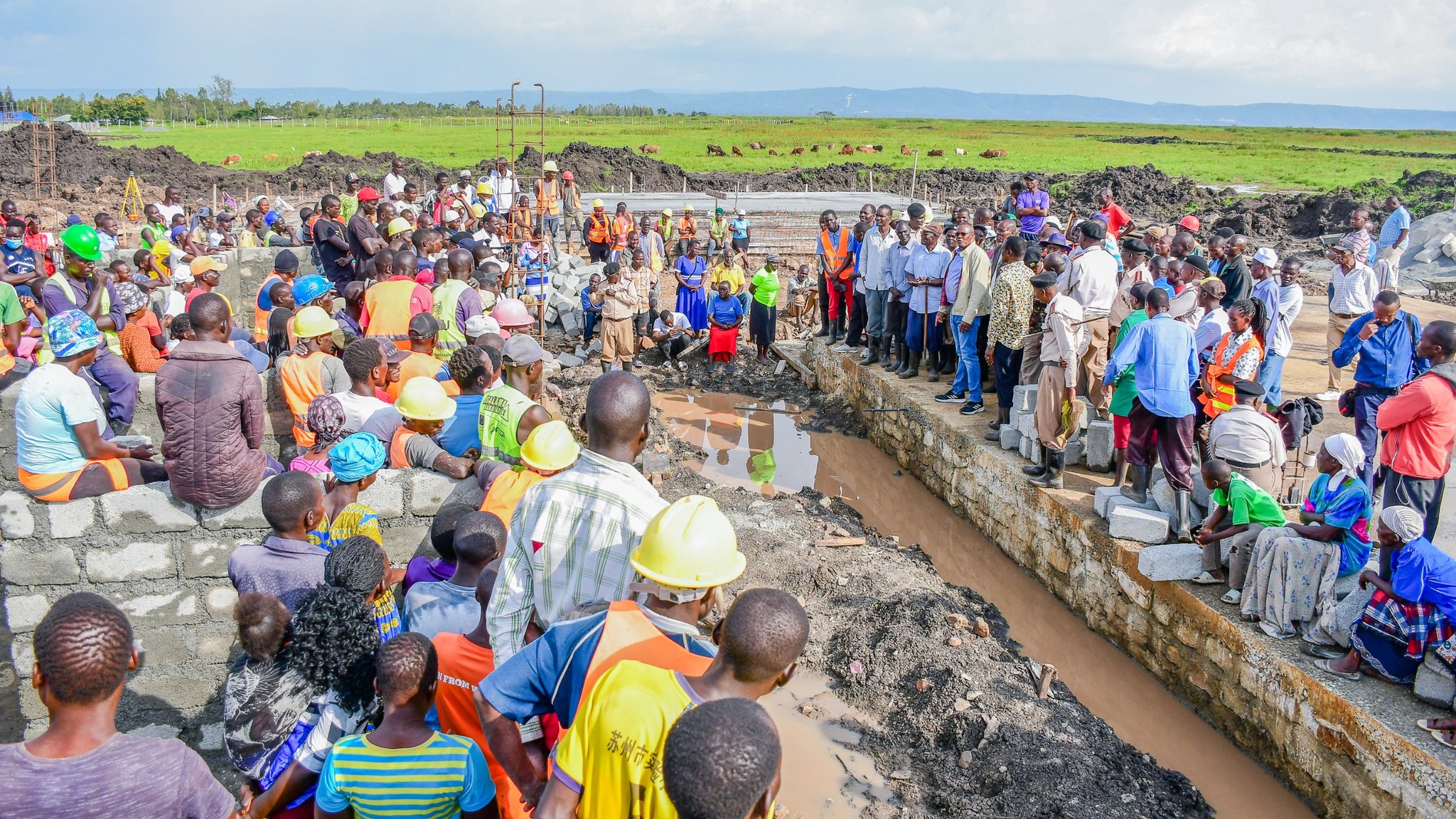 Residents mill around one of the construction sites to express their joy following the resumption of works at the project. PHOTOS/CHRIS MAHANDARA