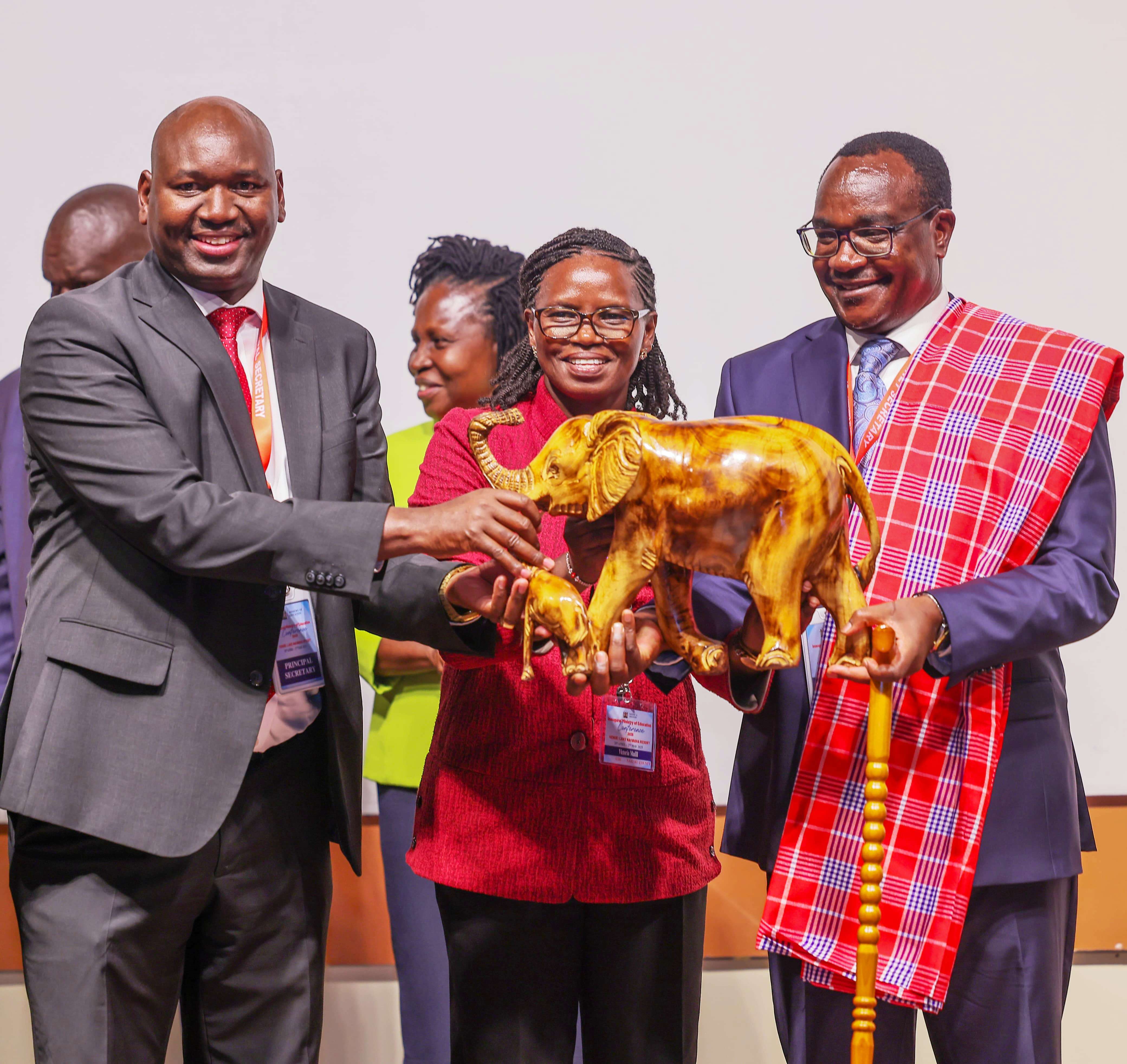  Education CS Julius Ogamba (right) receiving an elephant trophy from the Principal Secretary for Basic Education Prof. Julius Bittok (left) during the official launch of Education Conference in Naivasha. Photo/