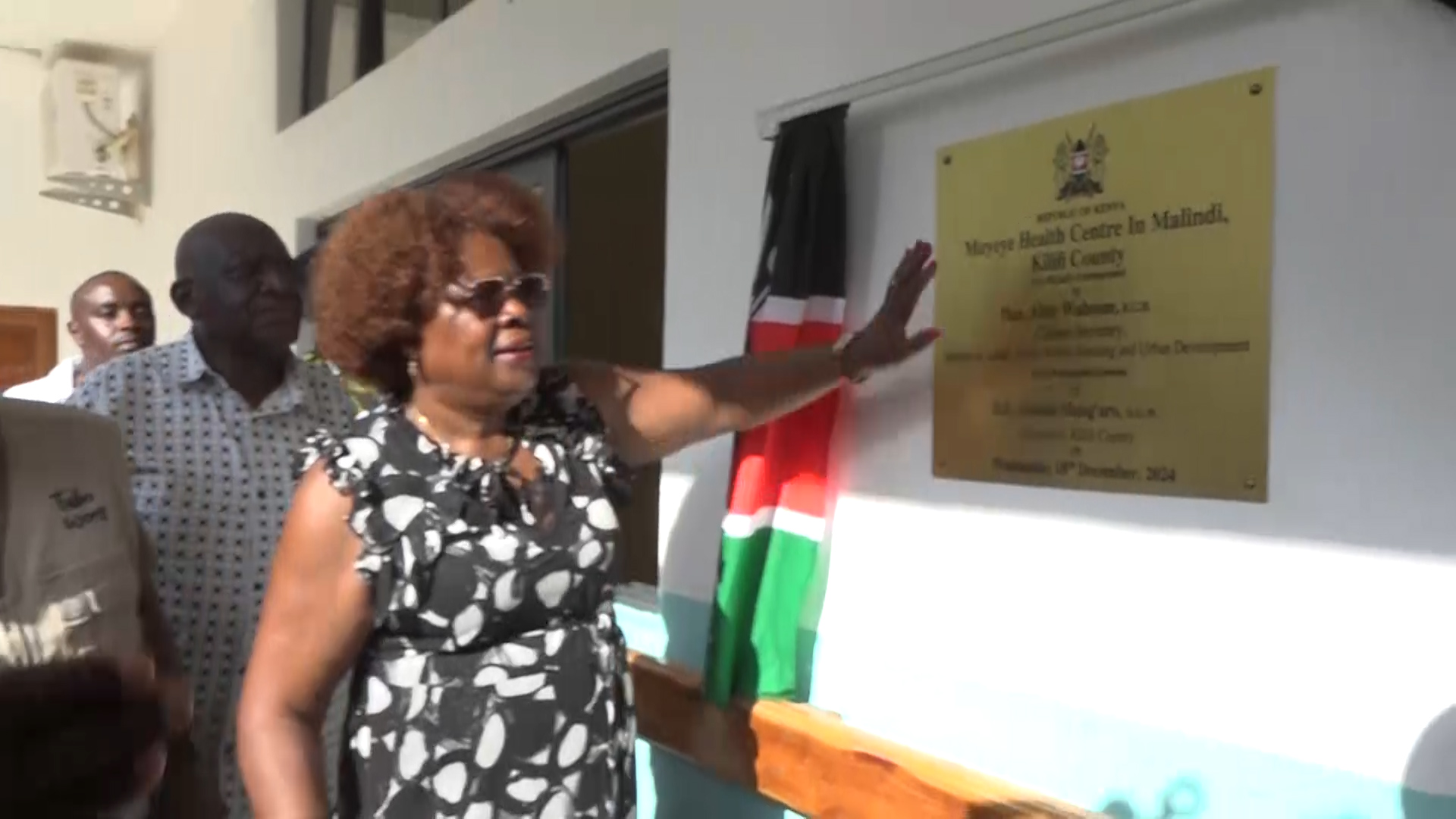 Lands CS Alice Wahome unveils the plaque to signify the official opening of the Muyeye Health Centre Maternity wing in Malindi town, Kilifi County. Photo/Emmanuel Masha