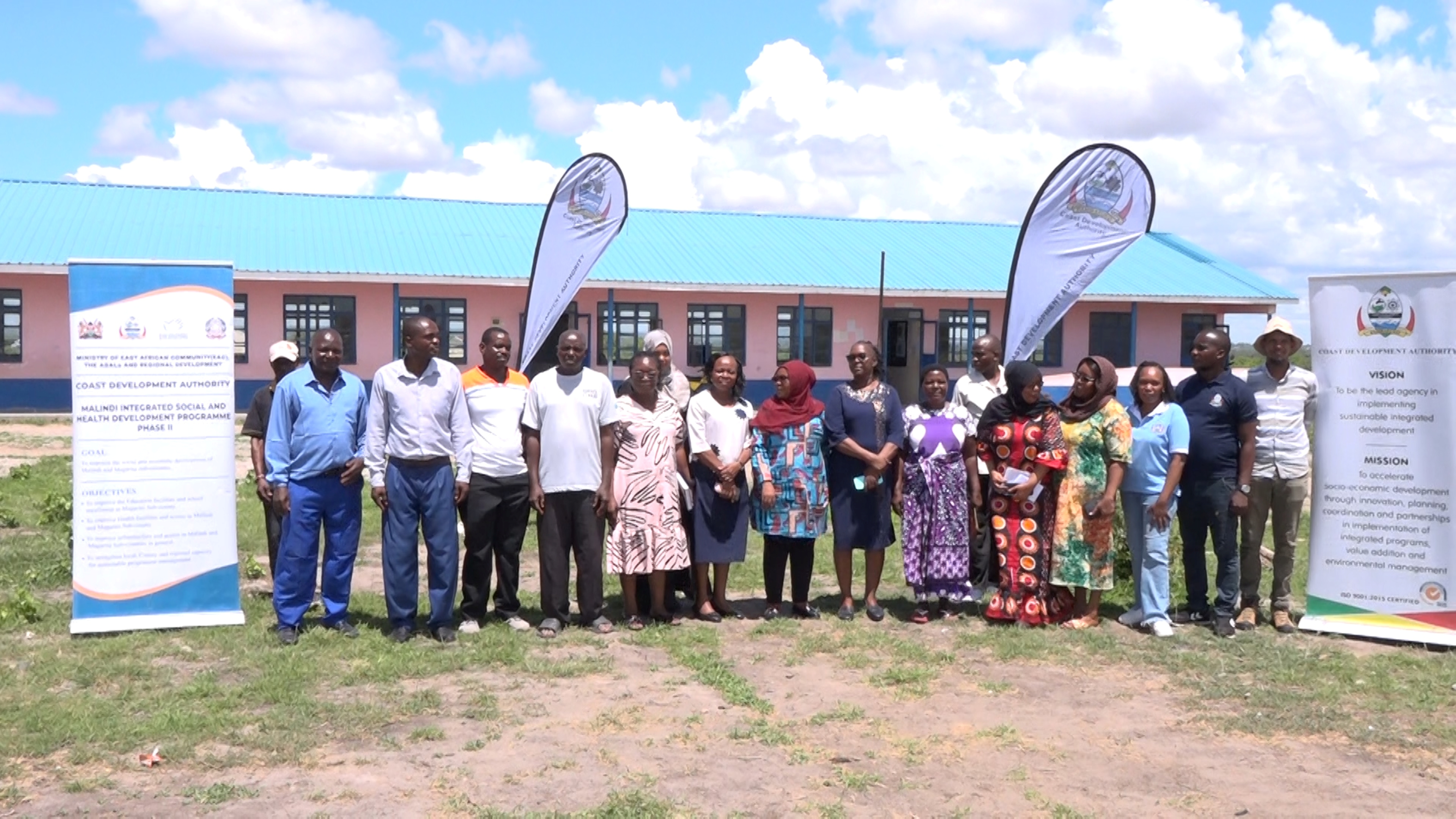 CDA project verification team led by acting MD Dr. Mwanasiti Bendera (centre) poses for a group photo with officials at the newly constructed Burangi Comprehensive School in Magarini Sub County, Kilifi County.