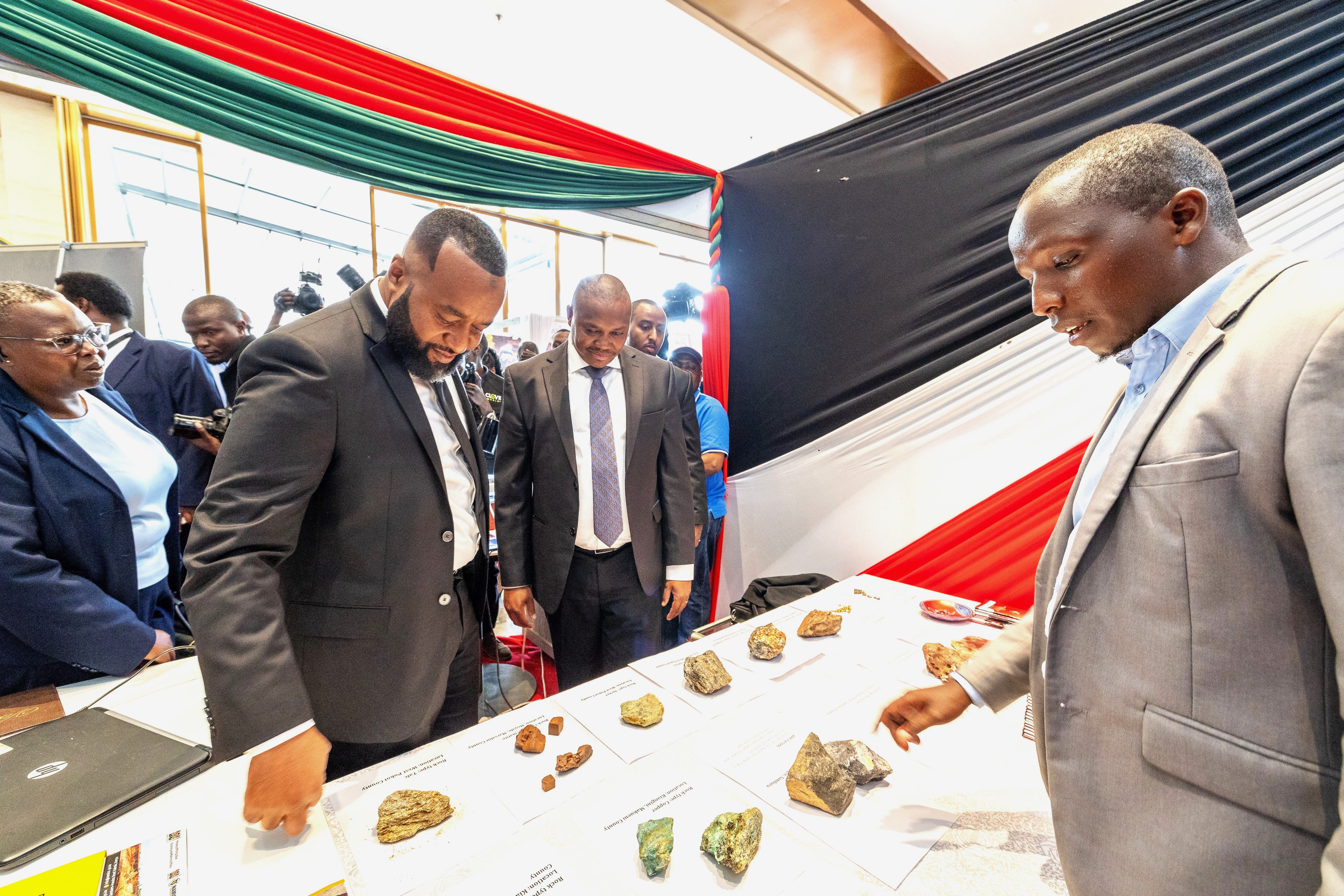 CS Mining Hassan Ali Joho (L) with PS Mining Elijah Mwangi studies mineral samples at one of the stands during the Mining Expo in Nairobi.