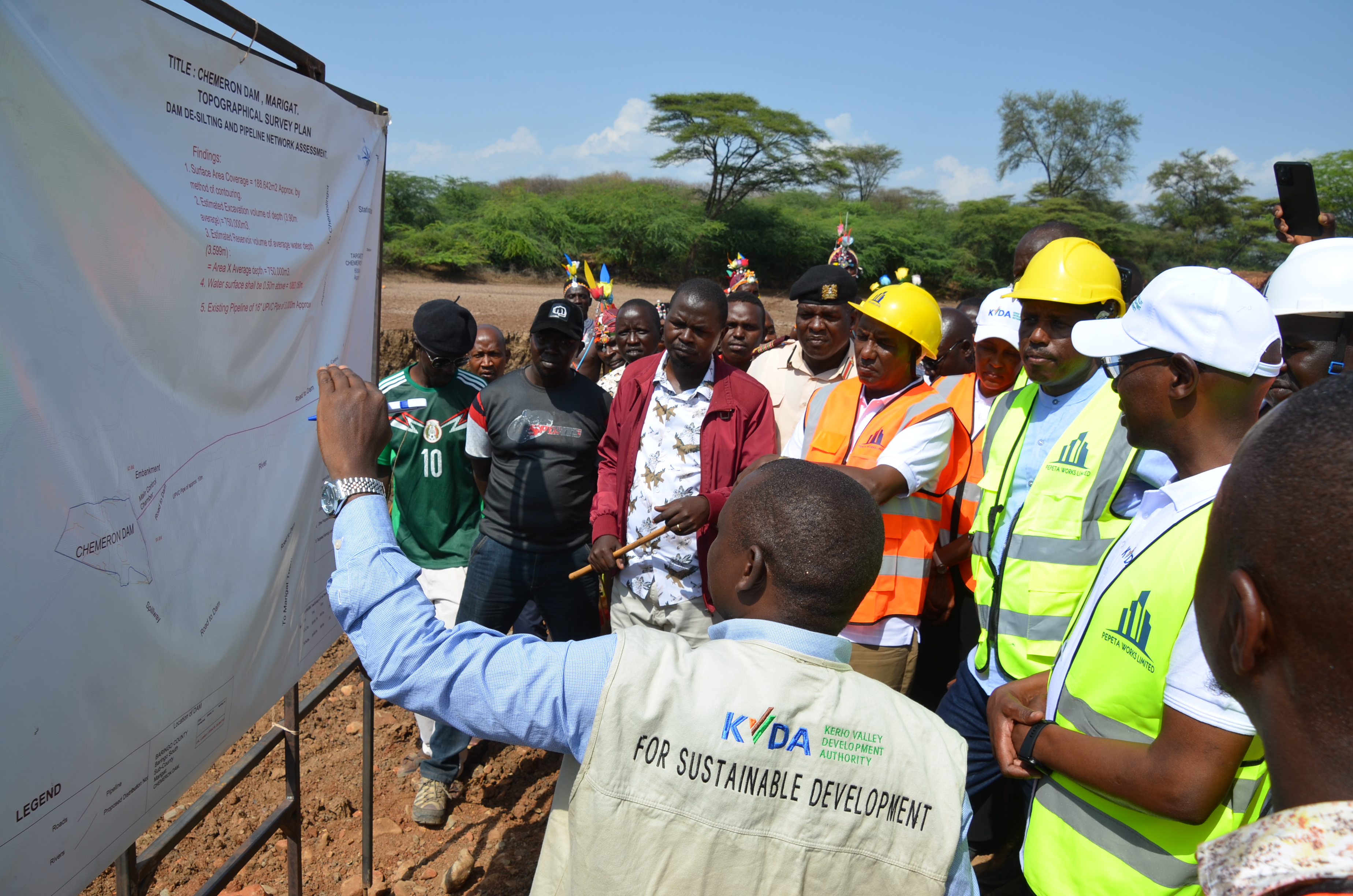 An official from KVDA explaining the survey plan for rehabilitation works of Chemeron Dam in Marigat Sub County. PHOTO: BENSON KELIO