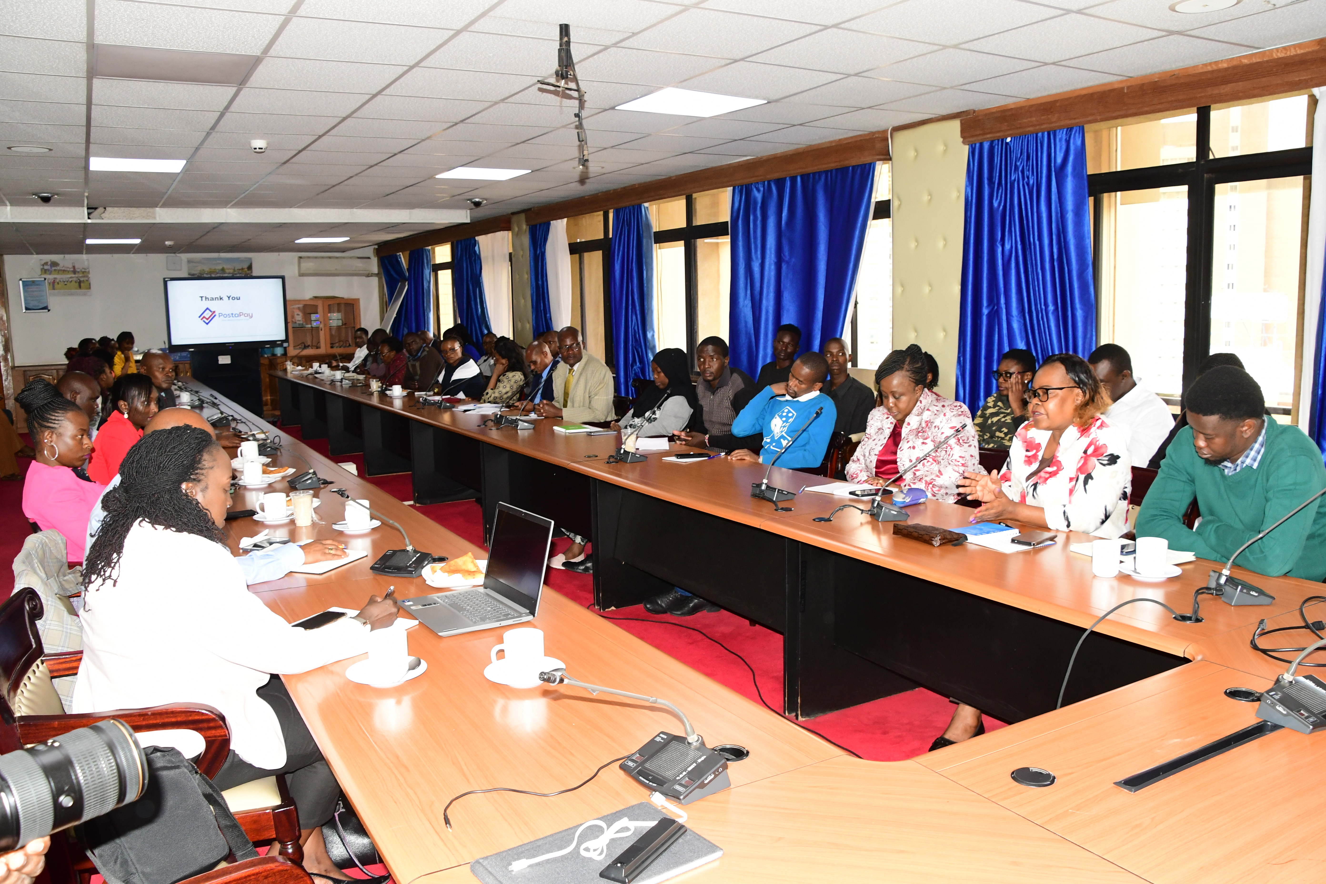Director Directorate of Public Communications Ministry of ICT and Digital Economy, Monica Omoro make her comments on the Postapay app, at Teleposta Towers during the sensitization and demonstration meeting. Photo/Norah Bochere