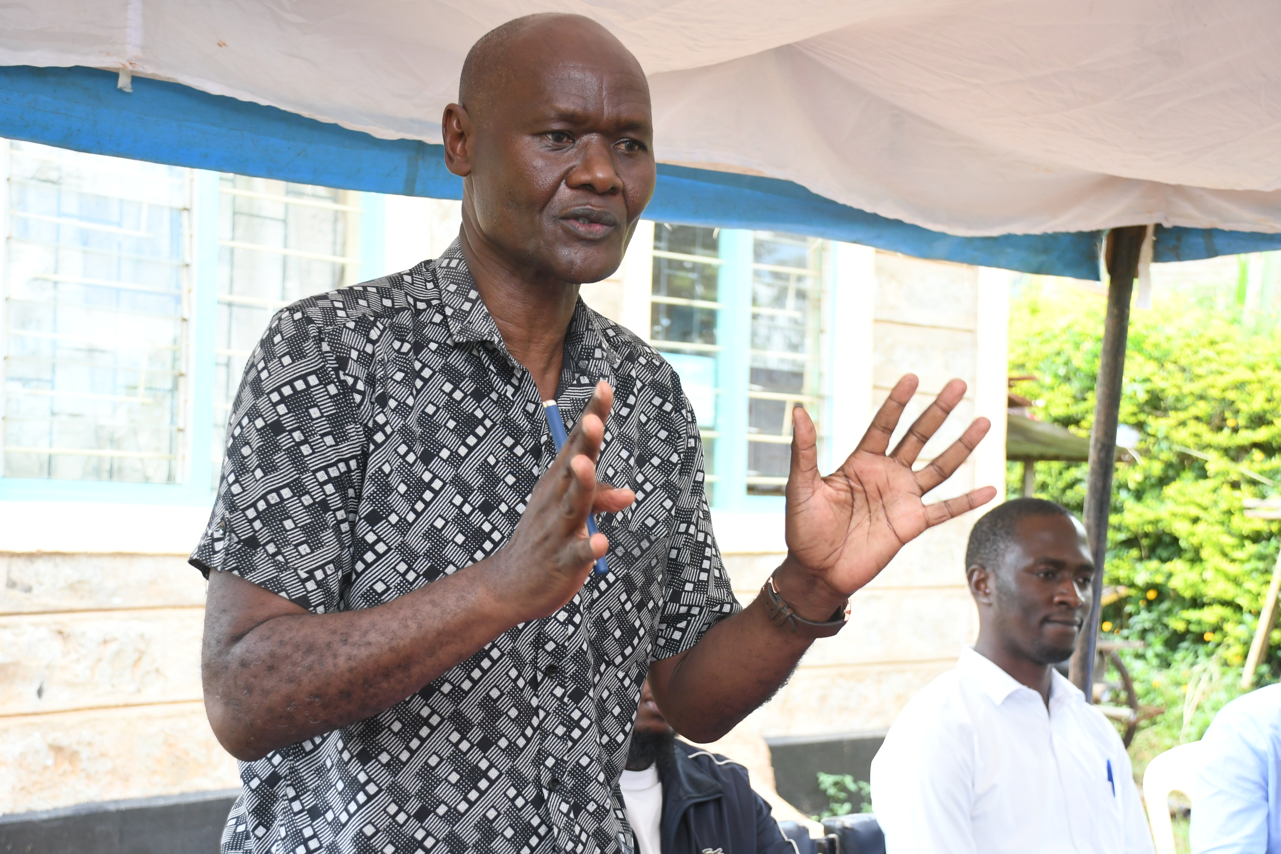 Director, Irrigation Water Management, who is also in charge of Farmer-Led Irrigation Development at the State Department for Irrigation, Daniel Odero speaks during Kiruki Kiende Irrigation project official site handover to Gamachu Construction Limited, to carry out rehabilitation works for the project at the IWUA offices in Gaturi South, Embu West Sub- County, Embu County